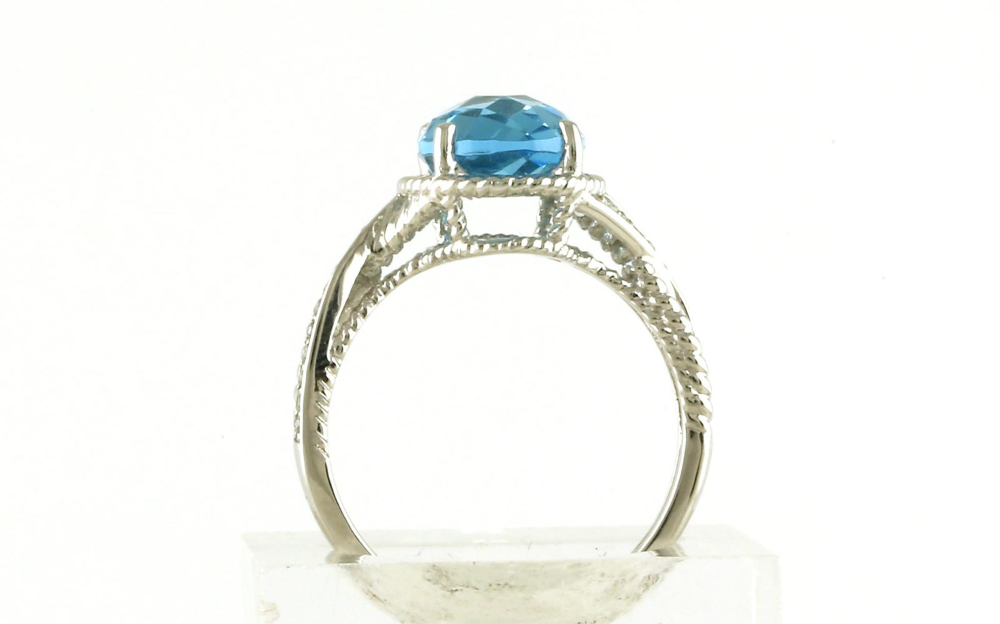 Halo-style Oval Blue Topaz and Diamond Ring with Rope Detail in White Gold