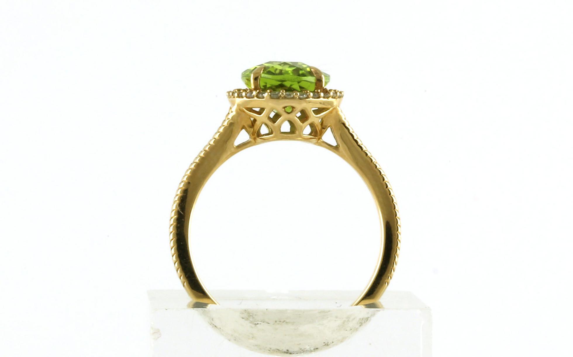 Halo-style Oval Peridot and Diamond Ring in Yellow Gold