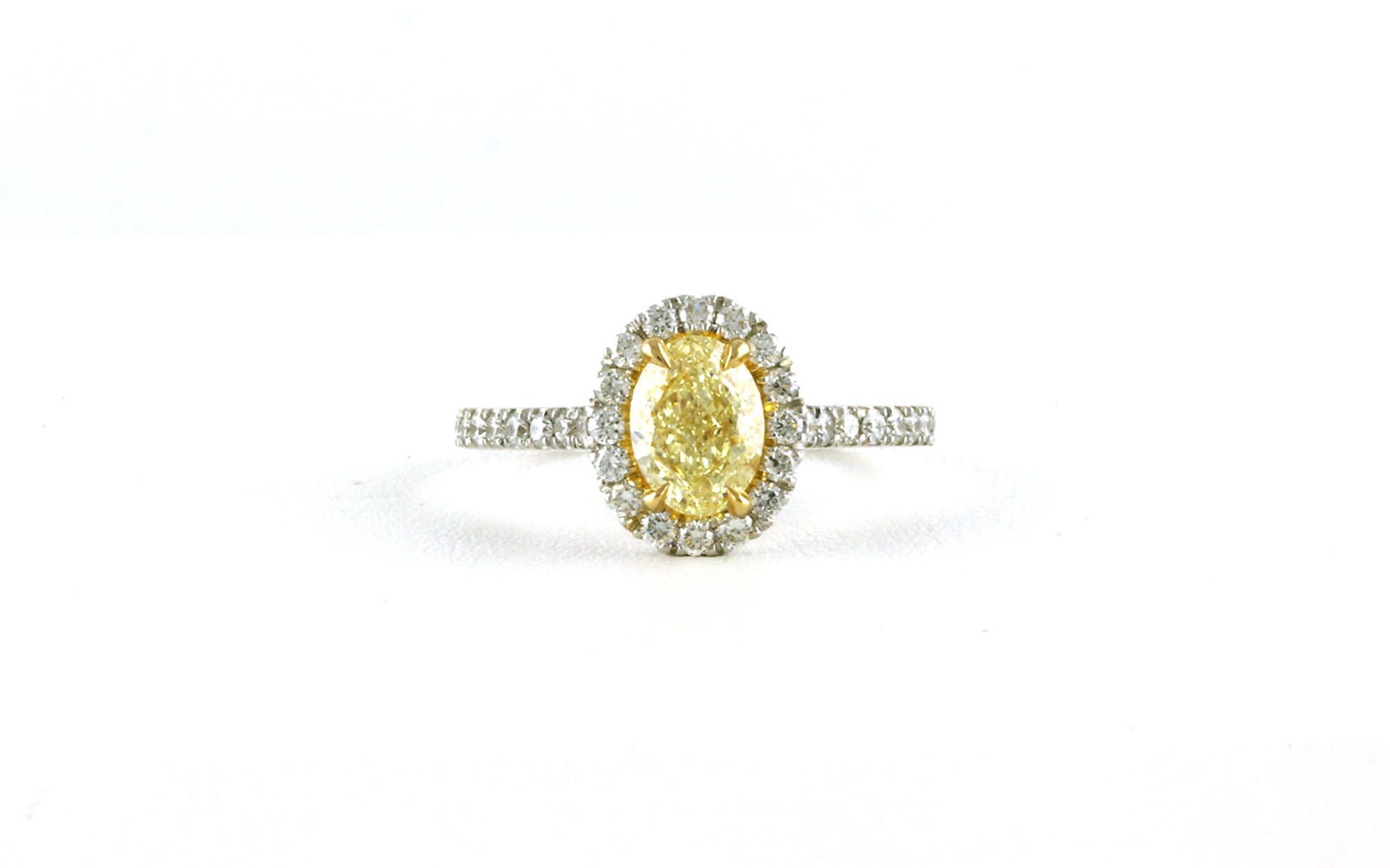 Halo-style Oval Fancy Yellow Diamond Ring in Two-tone White and Yellow Gold