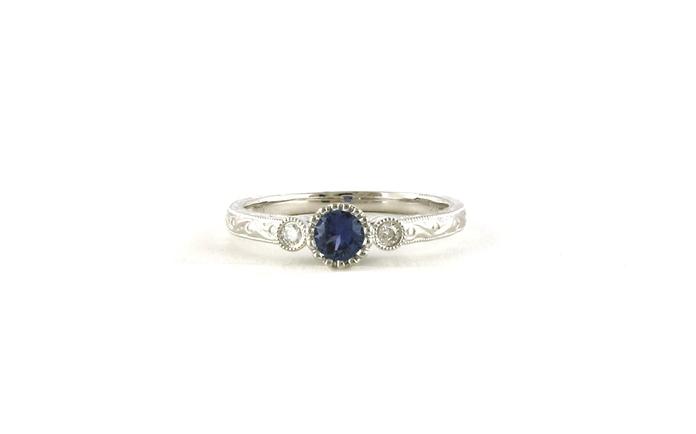 content/products/3-Stone Bezel-set Montana Yogo Sapphire and Diamond Ring with Hand Engraving and Milgrain Detail in White Gold (0.26cts TWT)