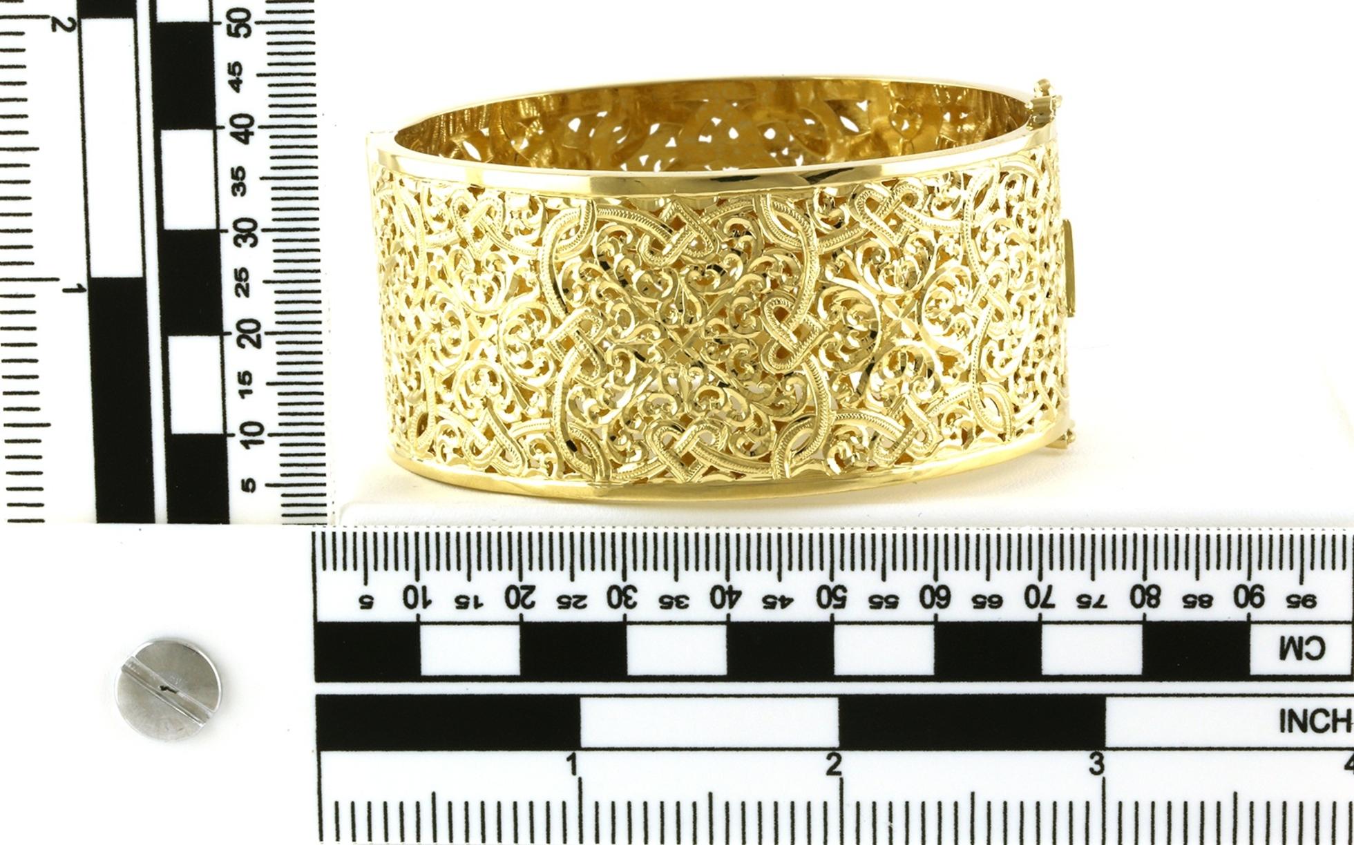 Estate Piece: Wide Filigree Hinged Bangle Bracelet in Yellow Gold scale