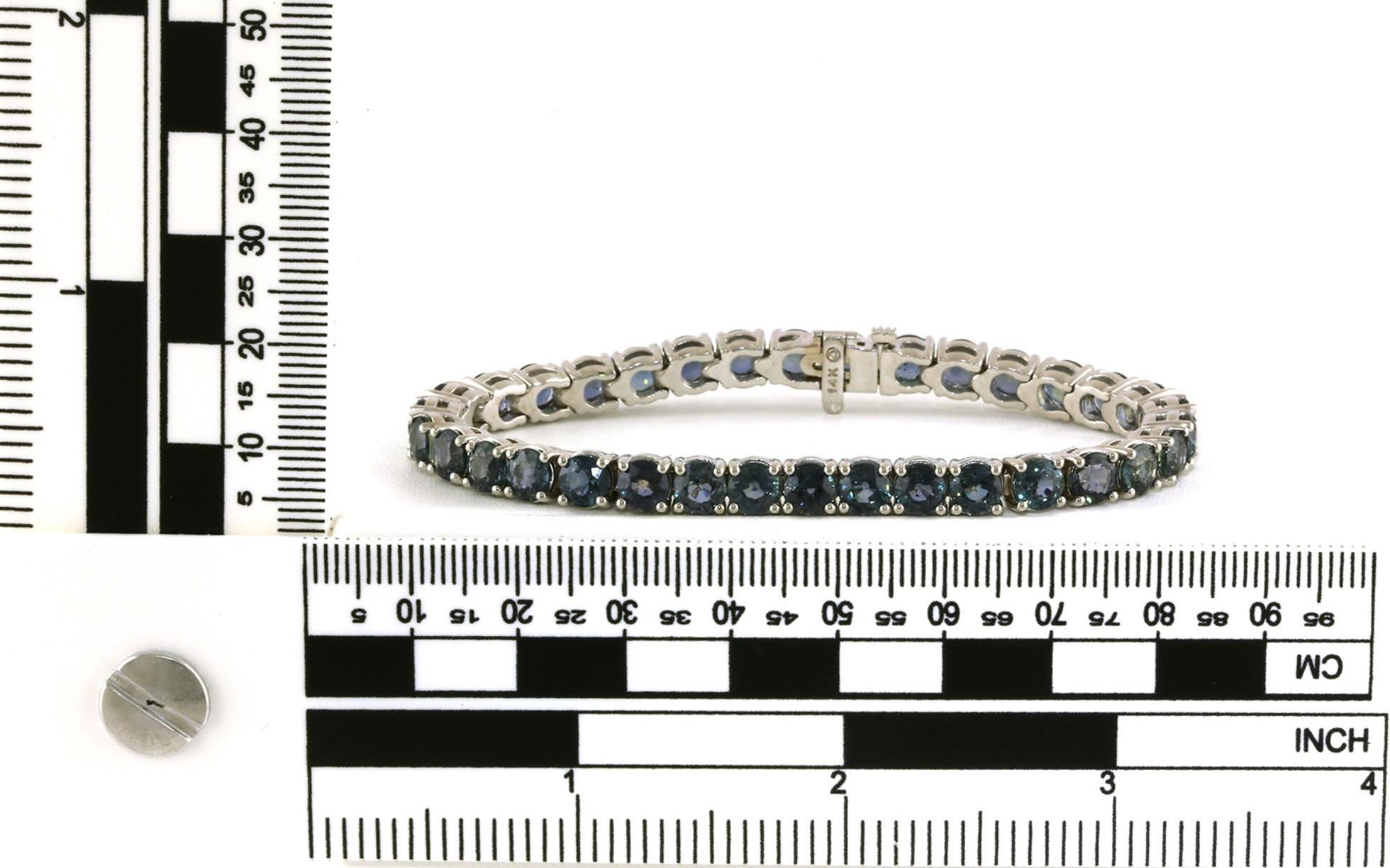 Teal Montana Sapphire Tennis Bracelet in White Gold (23.03cts TWT) scale