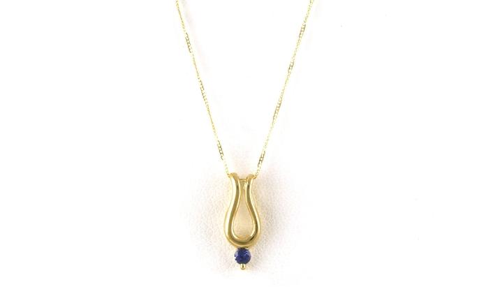 content/products/Curved Drop Montana Yogo Sapphire Necklace in Yellow Gold (0.10ct)