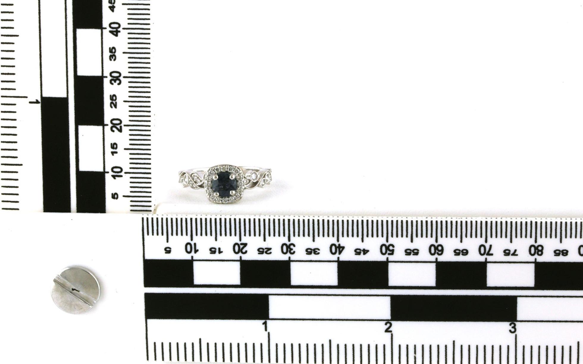 Estate Piece: Halo-style Montana Sapphire and Floral Diamond Ring in White Gold (0.81cts) scale