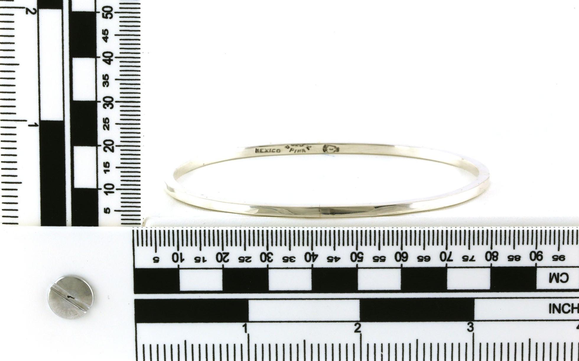 Estate Piece: Solid Oval Bangle Bracelet in Sterling Silver scale