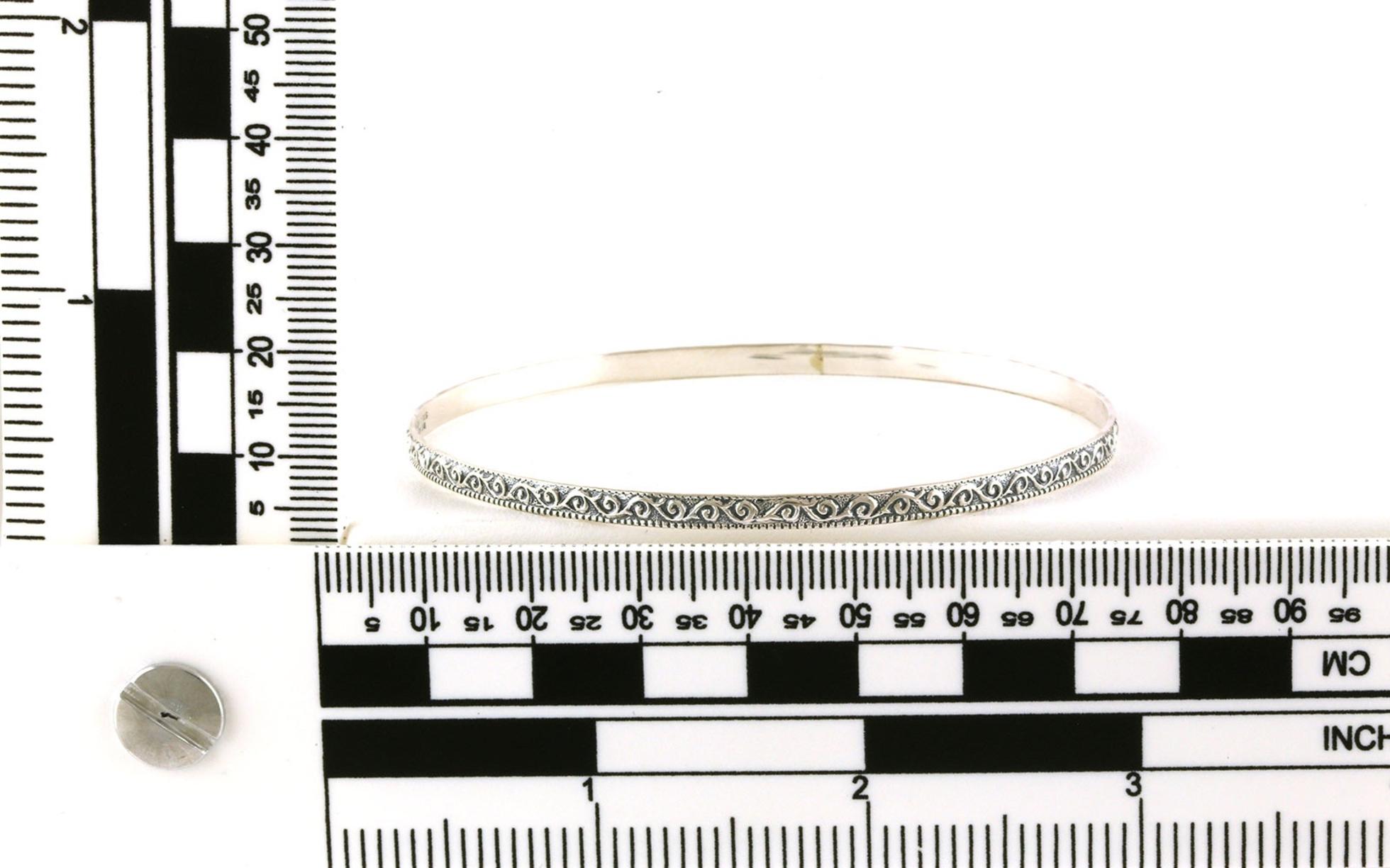 Estate Piece: Antiqued Engraved Bangle Bracelet in Sterling Silver scale