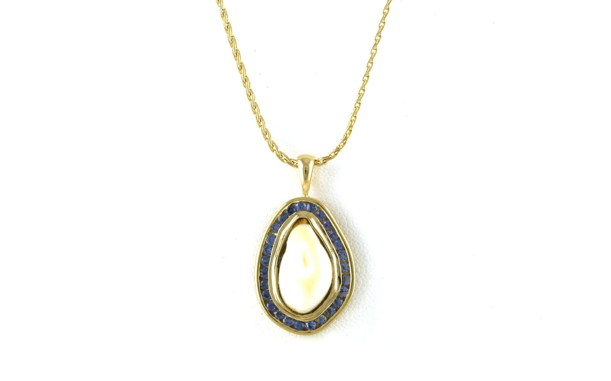 Estate Piece:  Bezel-set Elk Ivory and Channel-set Montana Yogo Sapphire Halo Necklace in Yellow Gold (0.81cts TWT)