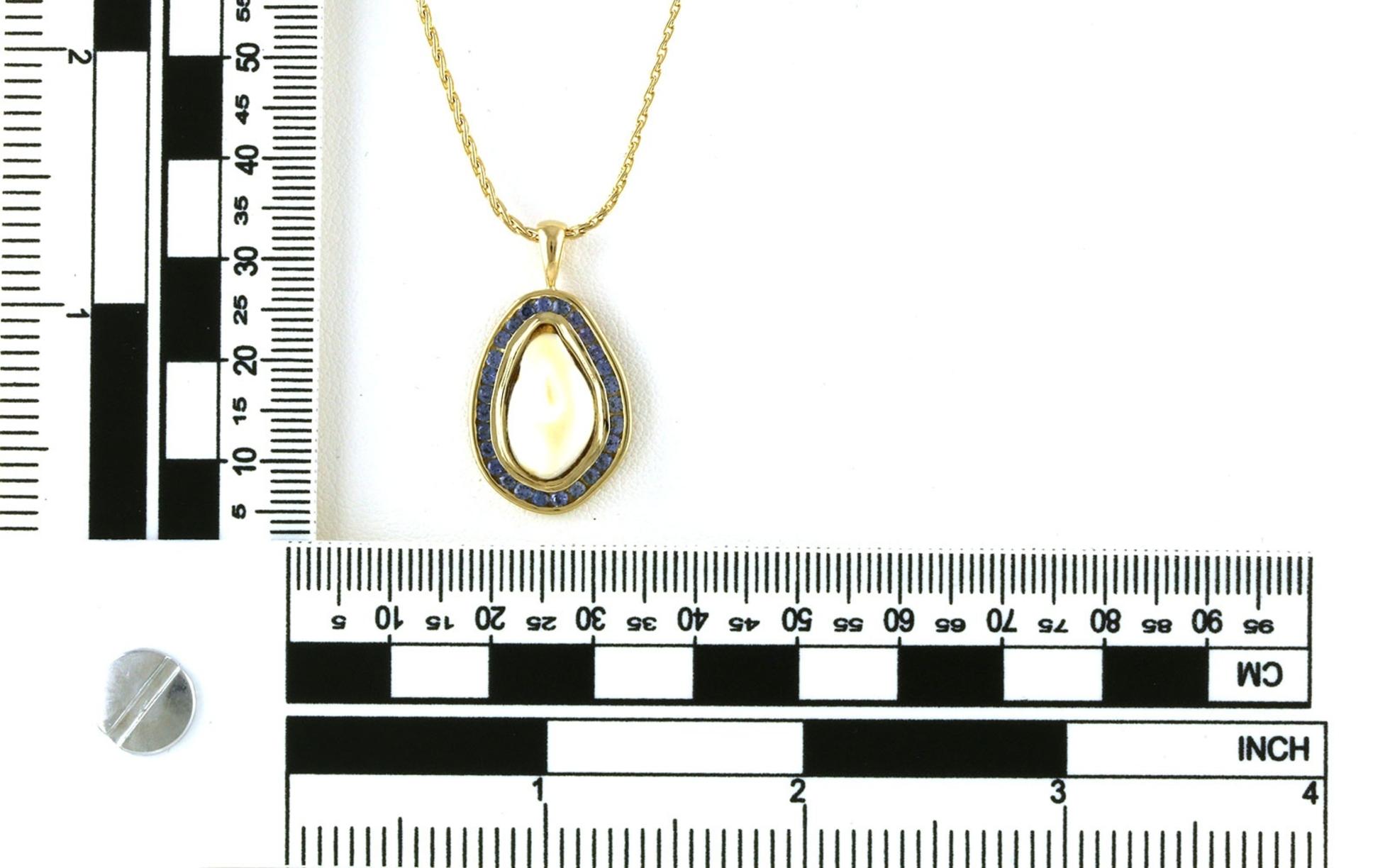 Estate Piece:  Bezel-set Elk Ivory and Channel-set Montana Yogo Sapphire Halo Necklace in Yellow Gold (0.81cts TWT) scale