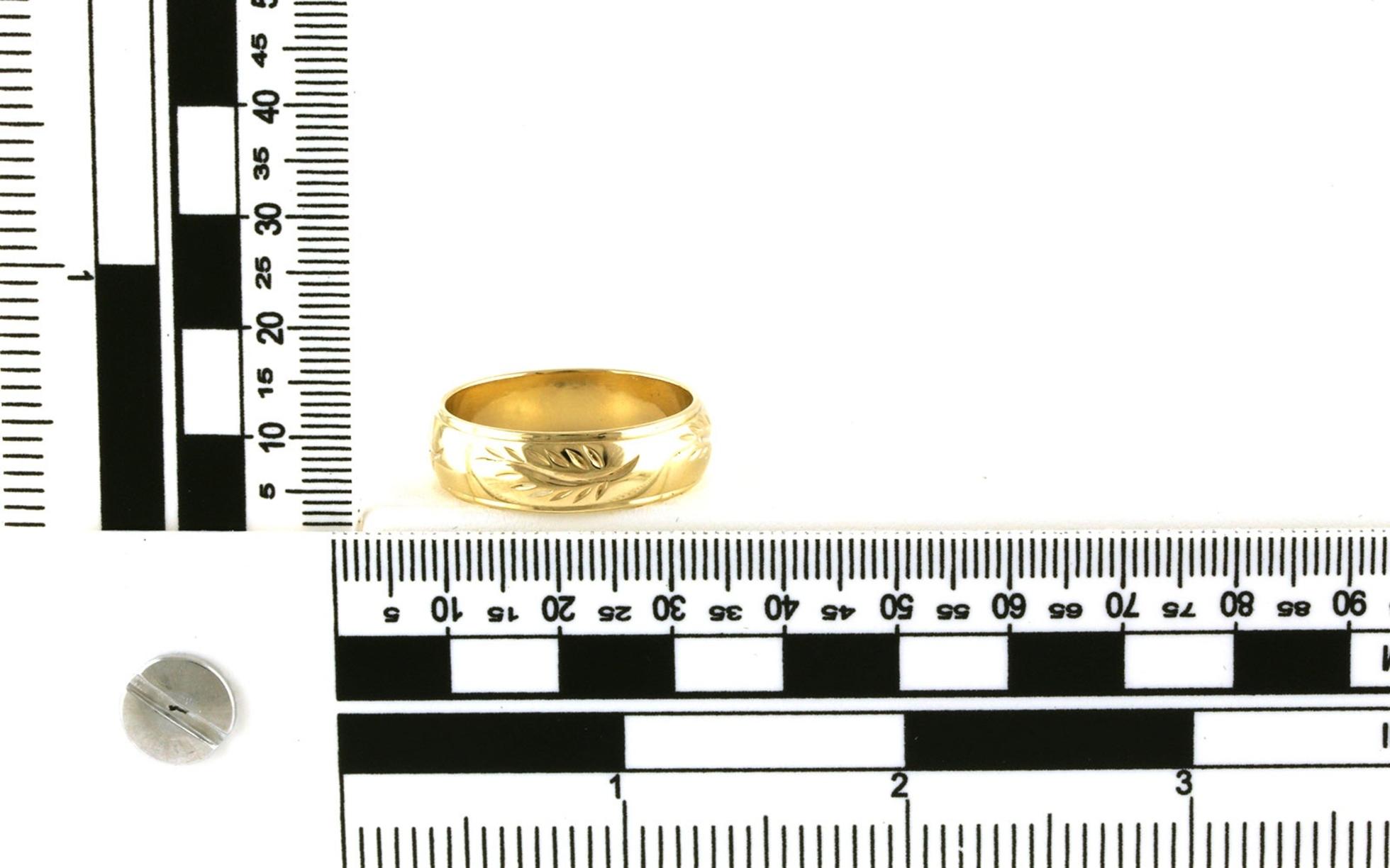 Estate Piece: Engraved Leaf Design Step Edge Wedding Band in Yellow Gold scale