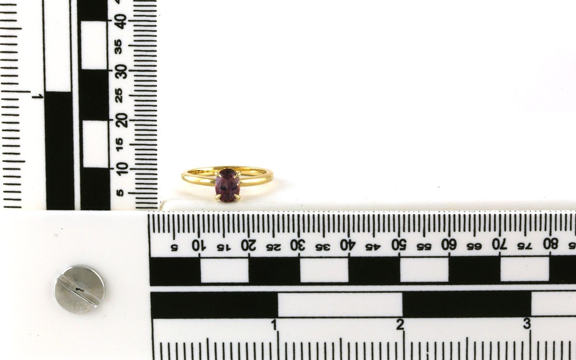 Solitaire-style Oval-cut Pinkish-Purple Montana Sapphire Ring in Yellow Gold (0.87cts) scale