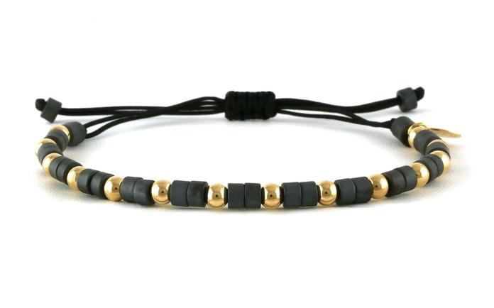 content/products/Bolo-style Hematite and Gold Beaded Bracelet on Black Nylon Cord