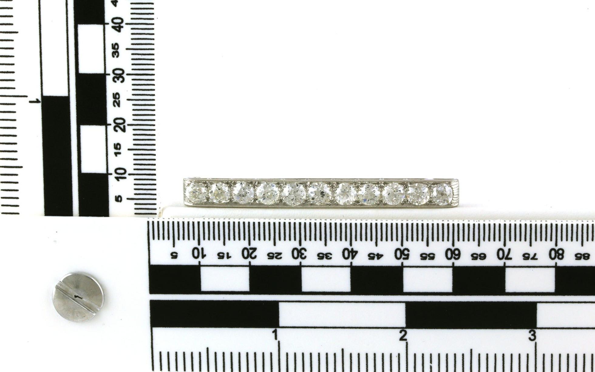 Estate Piece: 11-Stone Bar Diamond Pin with milgrain Detail in Platinum (2.75cts TWT) scale