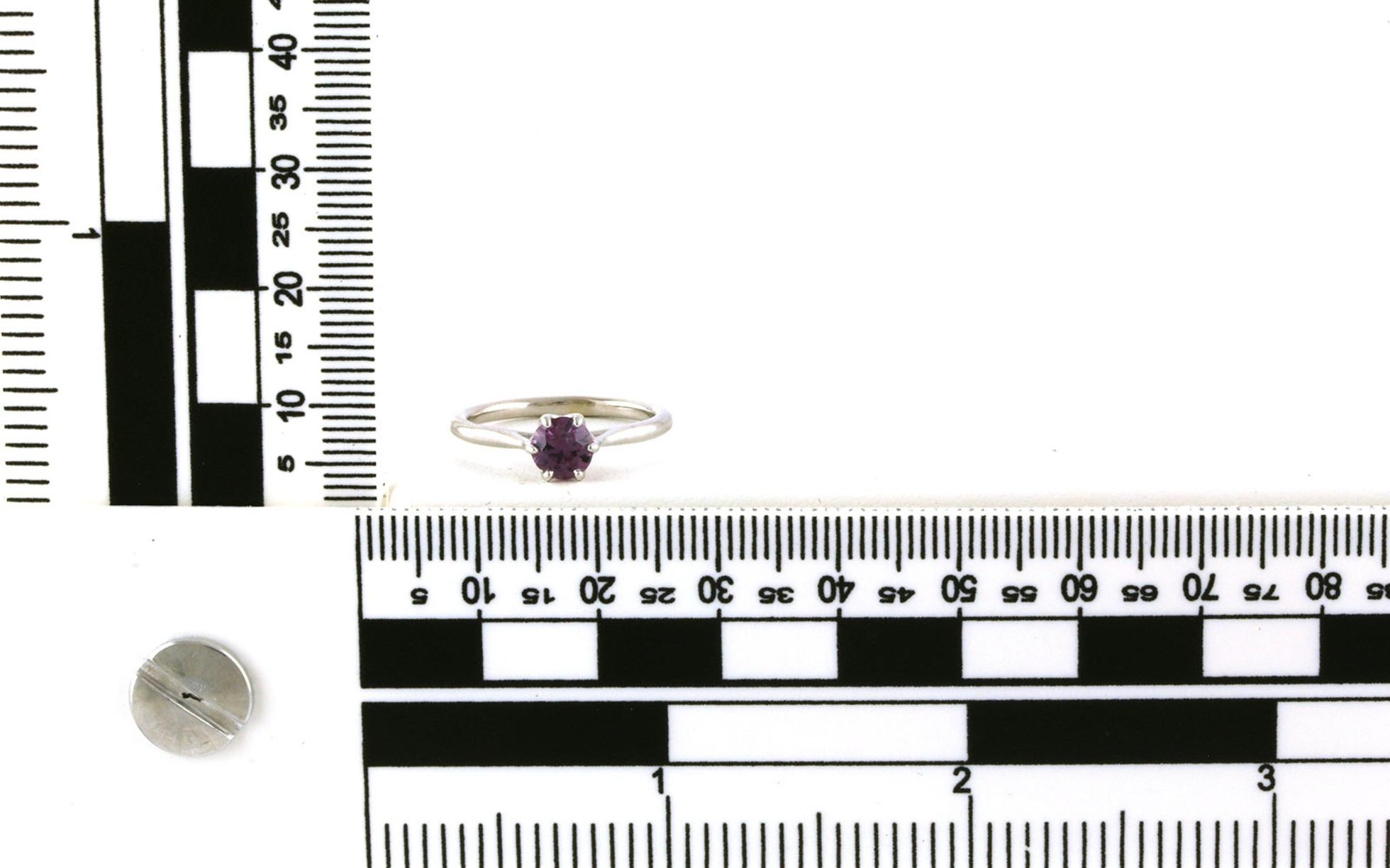 Solitaire-style 6-Prong Pinkish-Purple Montana Sapphire Ring in White Gold (0.64cts) scale