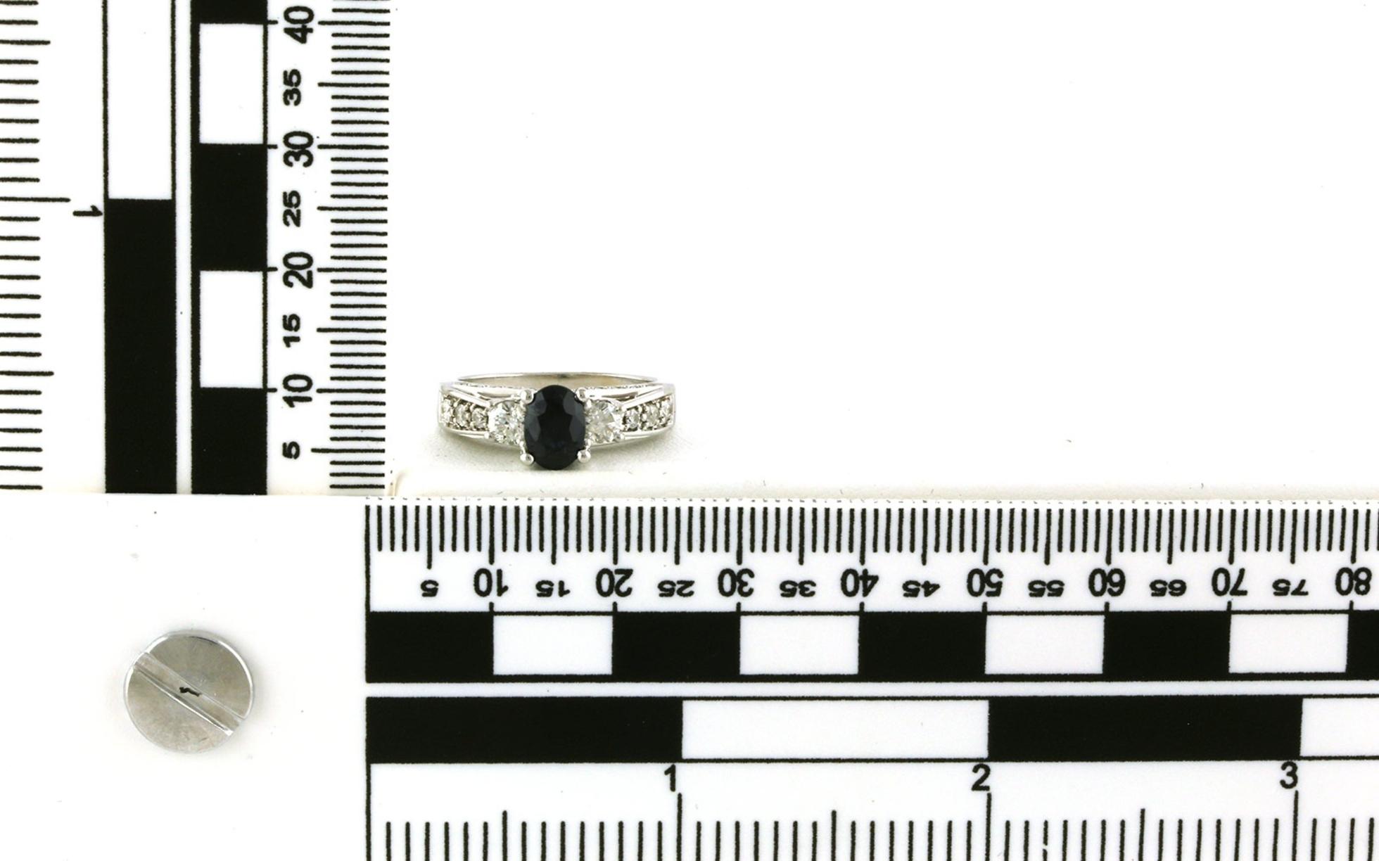 Estate Piece: 3-Stone Oval-cut Sapphire and Diamond Ring with Channel-set Accents in White Gold (1.50cts TWT) scale