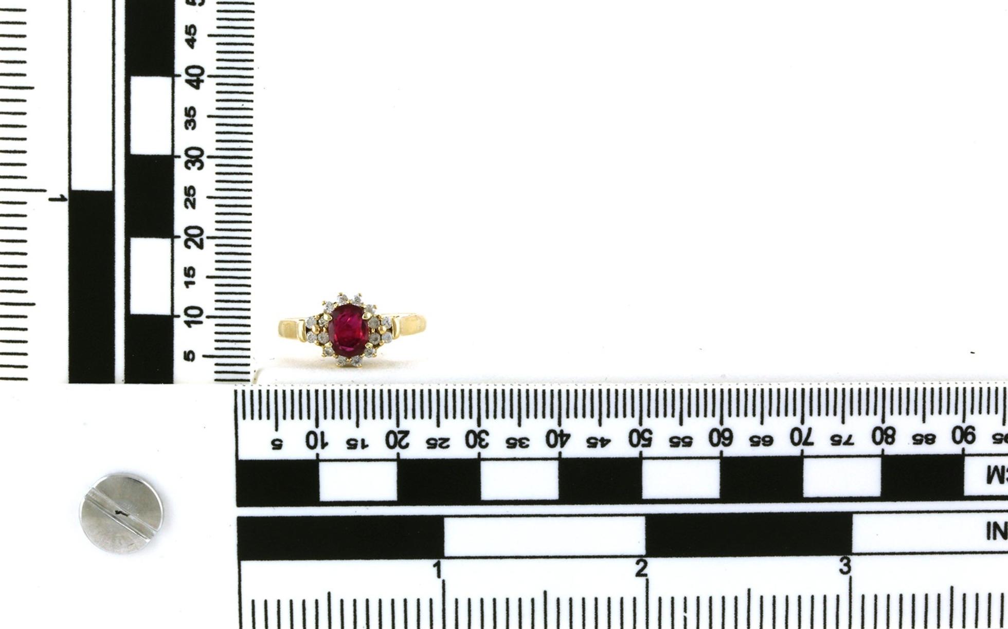 Estate Piece: Oval-cut Ruby and Diamond Cluster Ring in Yellow Gold (0.66cts TWT) scale