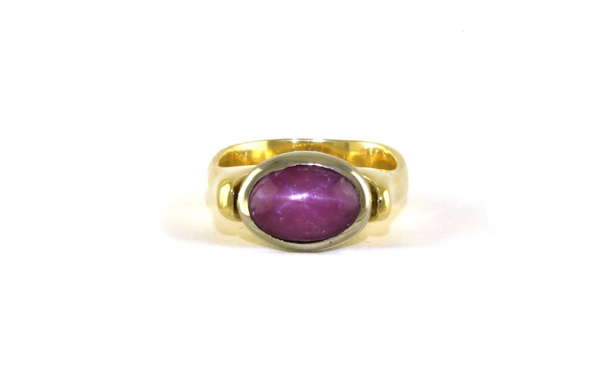 Estate Piece: East-West Bezel-set Oval Cabochon-cut Star Ruby Ring in Two-tone Yellow and White Gold (2.00cts)