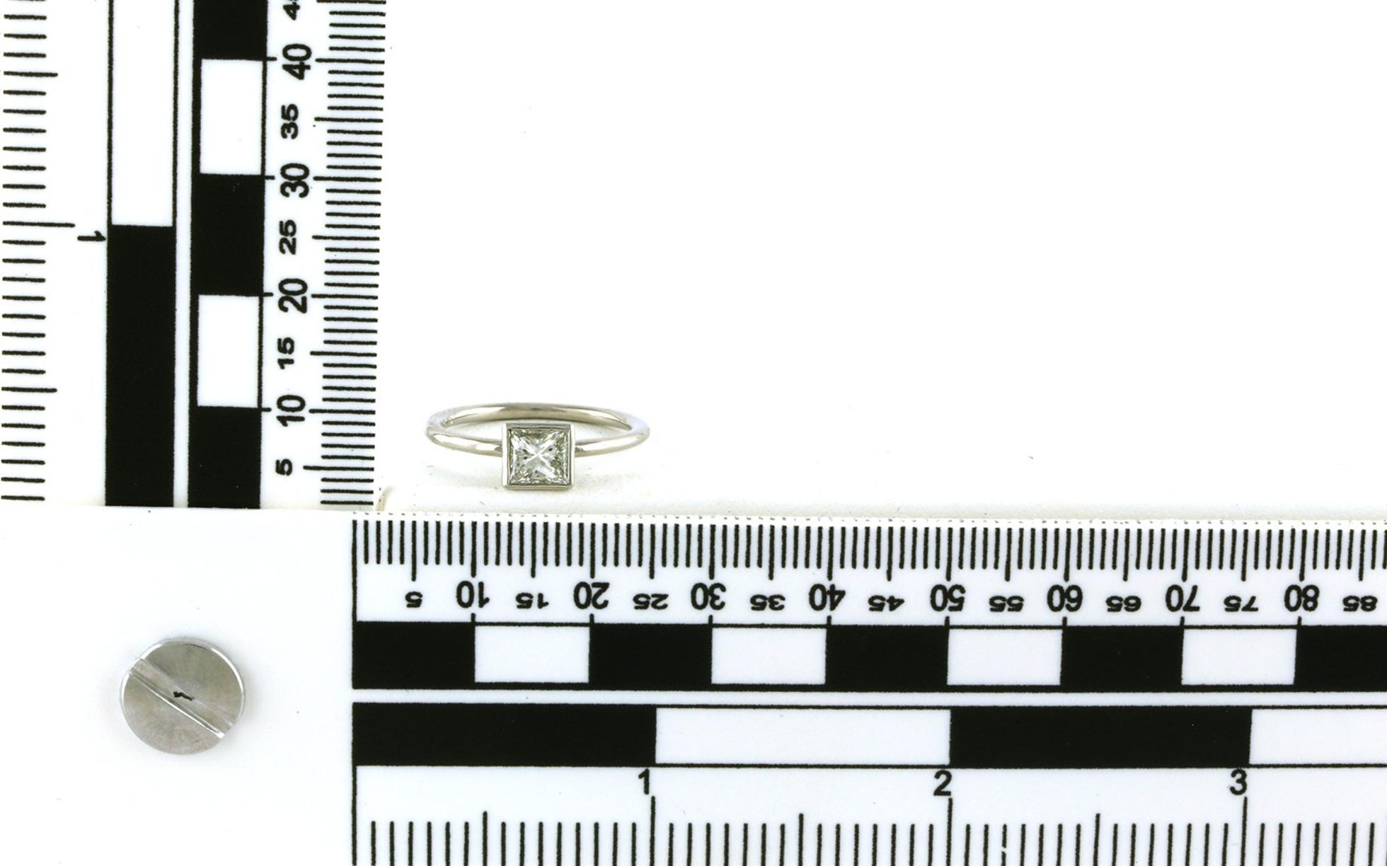 Estate Piece: Solitaire Bezel-set Princess-cut Diamond Ring in Platinum (0.50cts) scale