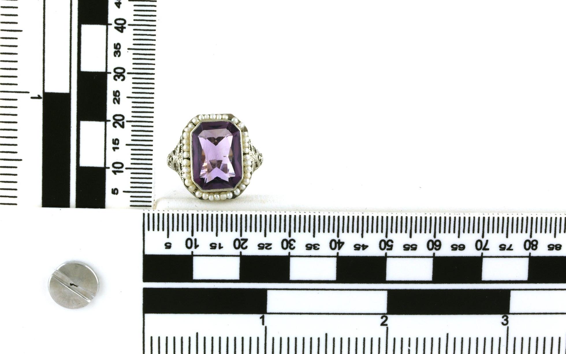 Estate Piece: Pearl Halo Emerald-cut Amethyst Cocktail Ring with Filigree Details in White Gold scale