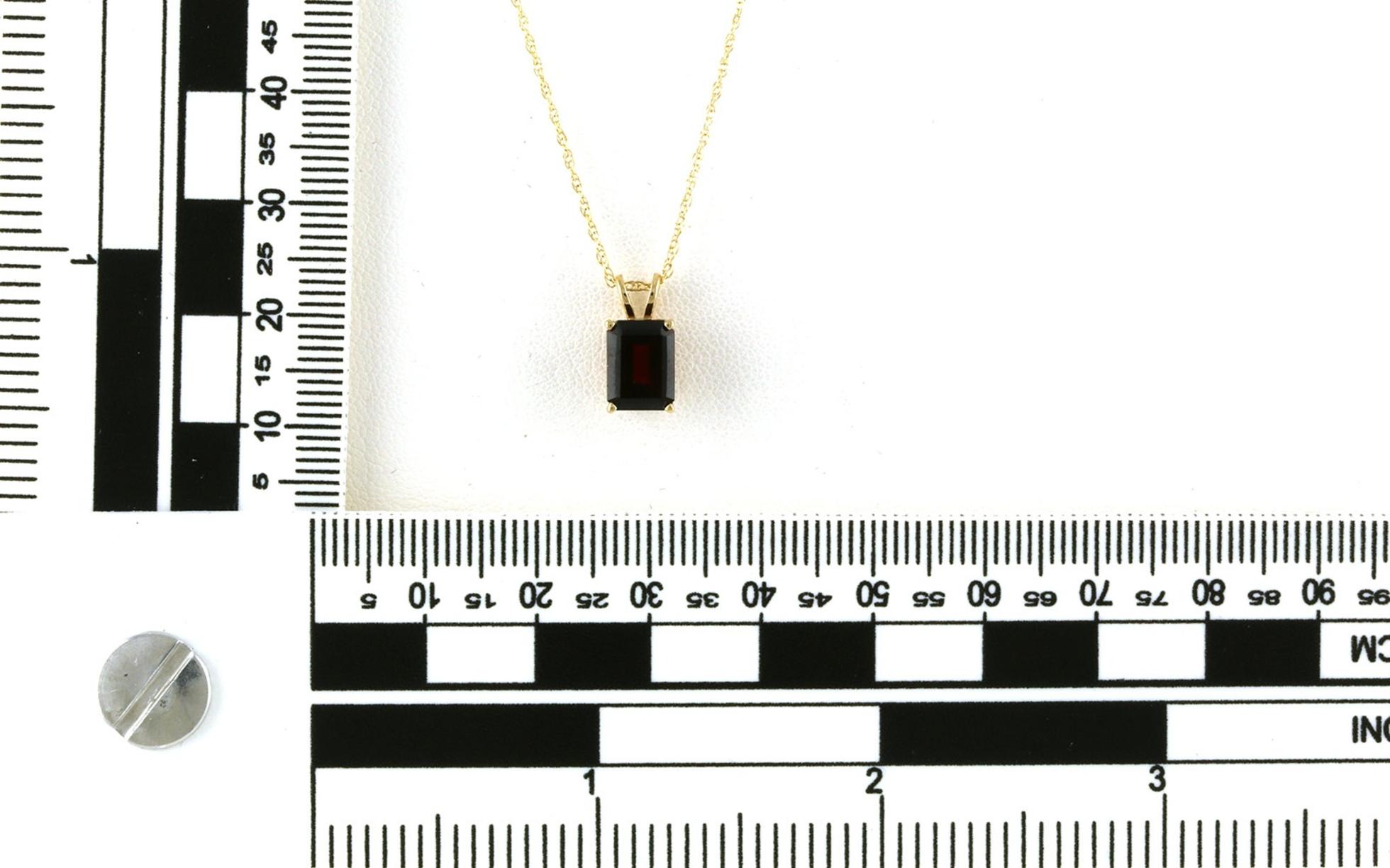 Estate Piece: Solitaire-style Emerald-cut Garnet Necklace in Yellow Gold scale