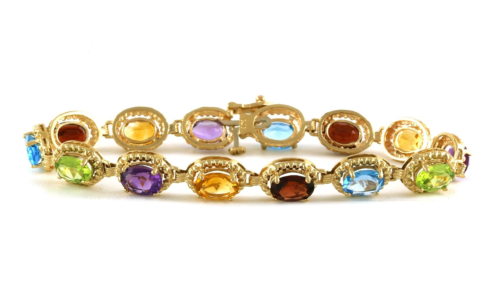Estate Piece: Rainbow Amethyst, Peridot, Citrine, Blue Topaz, and Garnet Line Bracelet in Yellow Gold