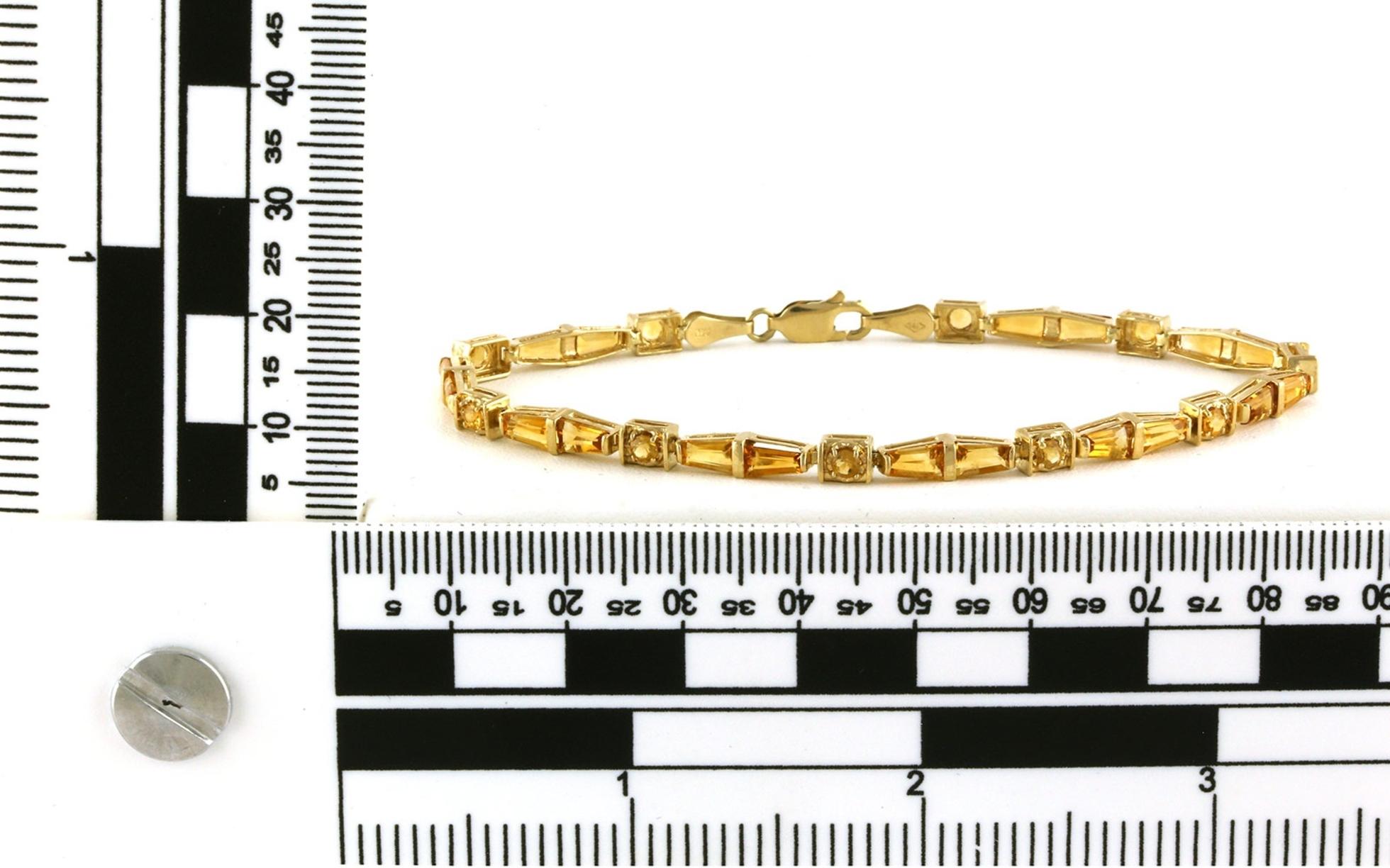 Estate Piece: Alternating Tapered Baguette and Round Citrine Line Bracelet in Yellow Gold scale