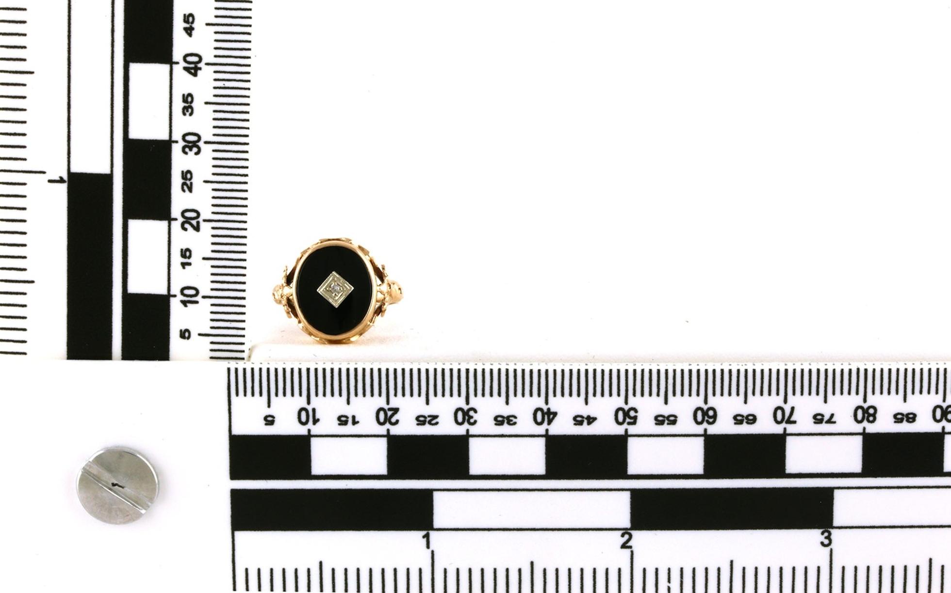 Estate Piece: Oval Onyx and In-set Diamond Cocktail Ring in Rose Gold scale
