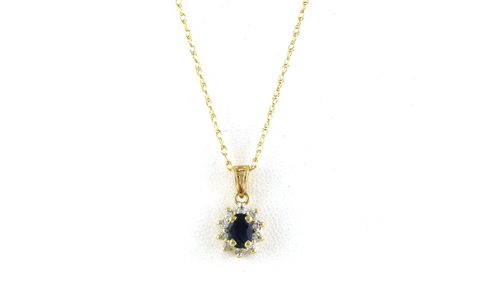 Estate Piece: Halo-style Oval-cut Sapphire and Diamon Necklace in Two-tone Yellow Gold with Rhodium Plating (0.60cts TWT)