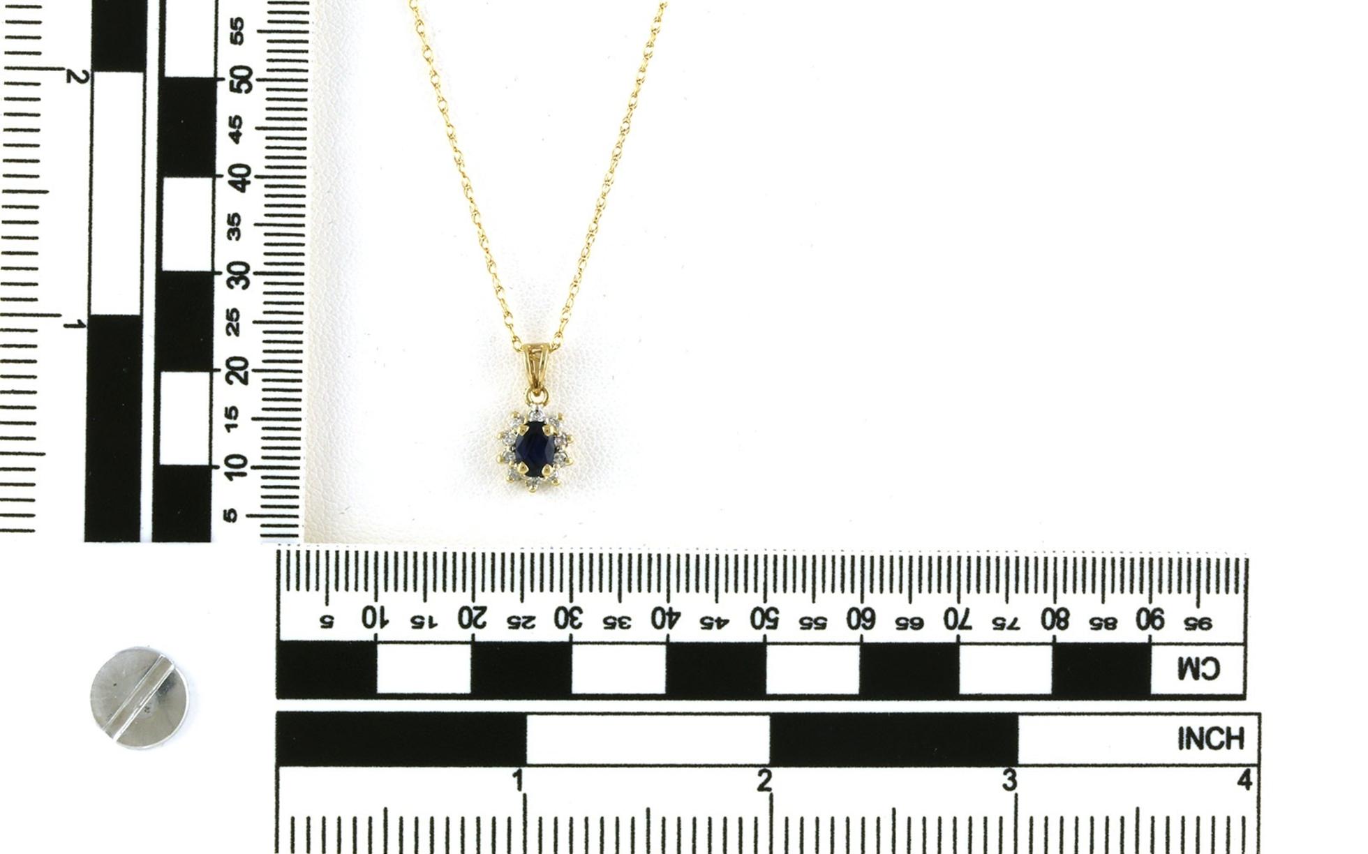 Estate Piece: Halo-style Oval-cut Sapphire and Diamon Necklace in Two-tone Yellow Gold with Rhodium Plating (0.60cts TWT) scale