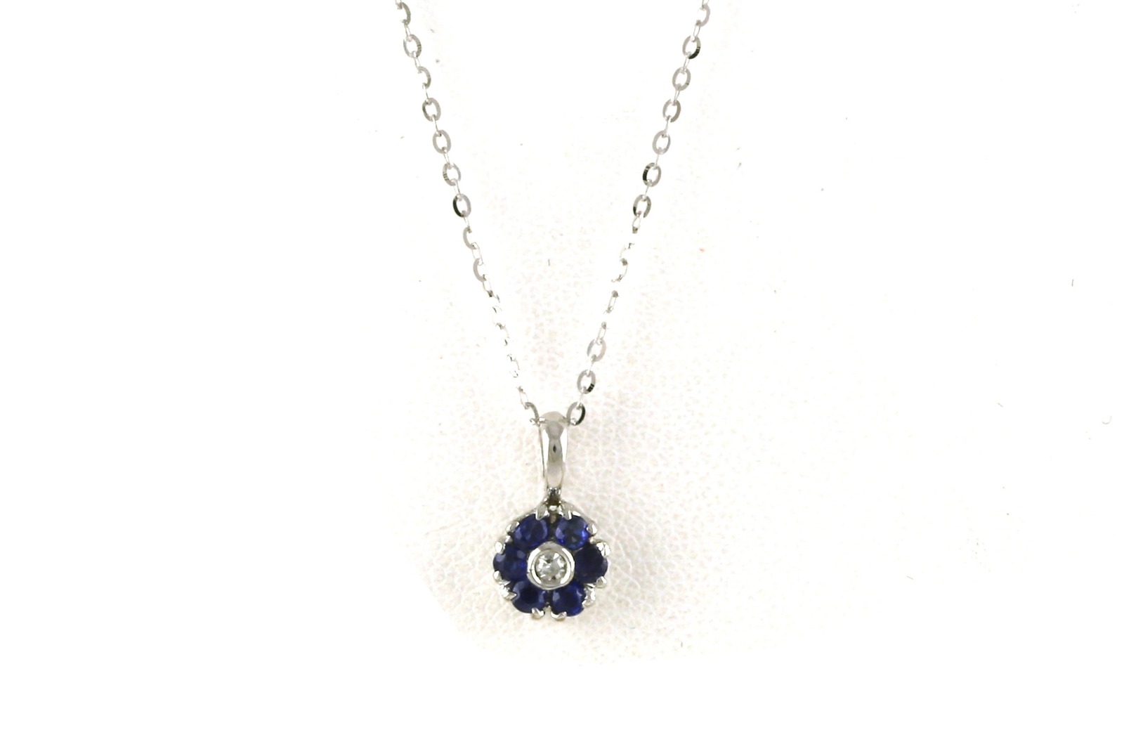 Estate Piece: Sapphire and Diamond 7-Stone Flower Cluster Necklace in White Gold (0.15cts TWT)
