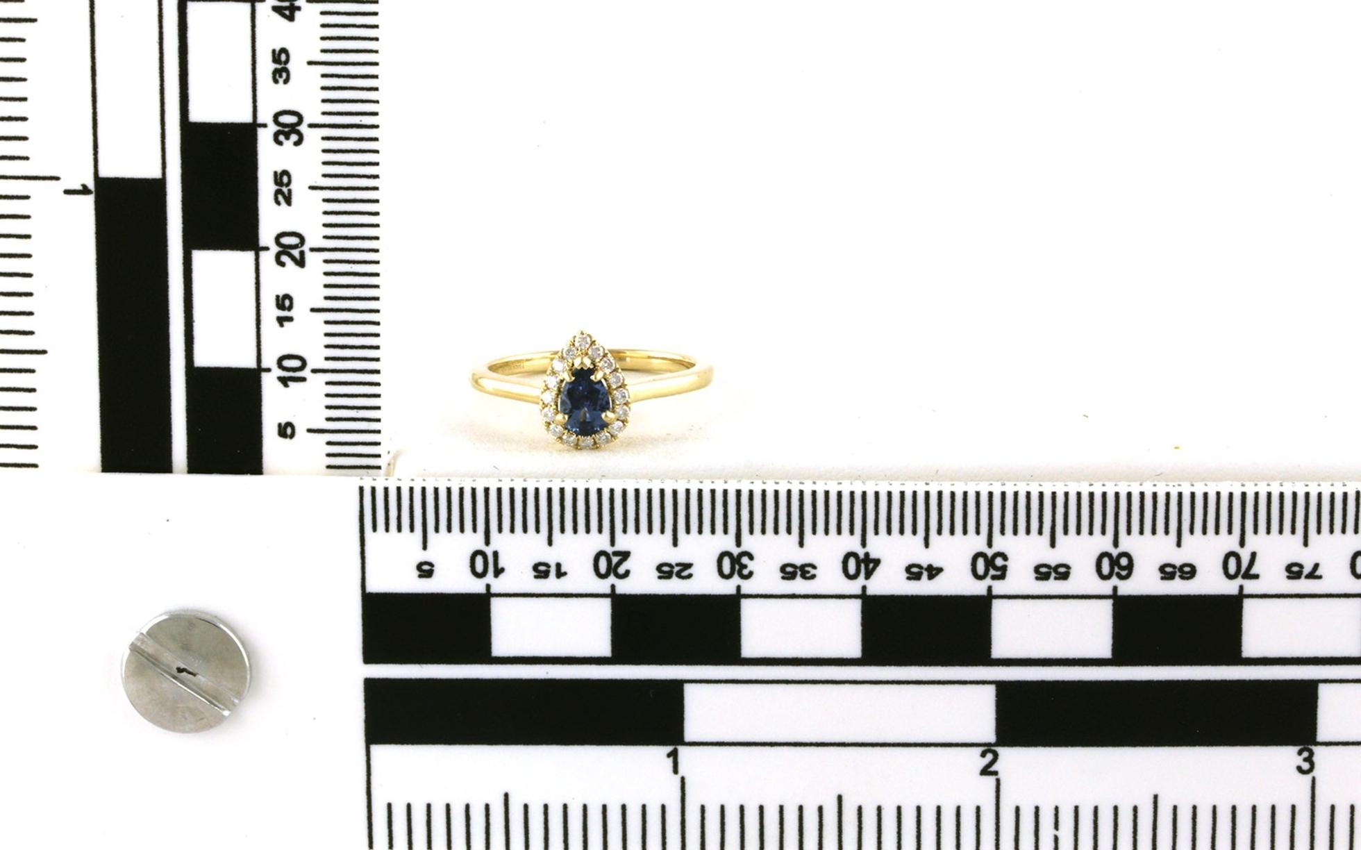 Montana Yogo Sapphire and Diamond Halo Ring in Yellow Gold (0.52cts TWT) scale