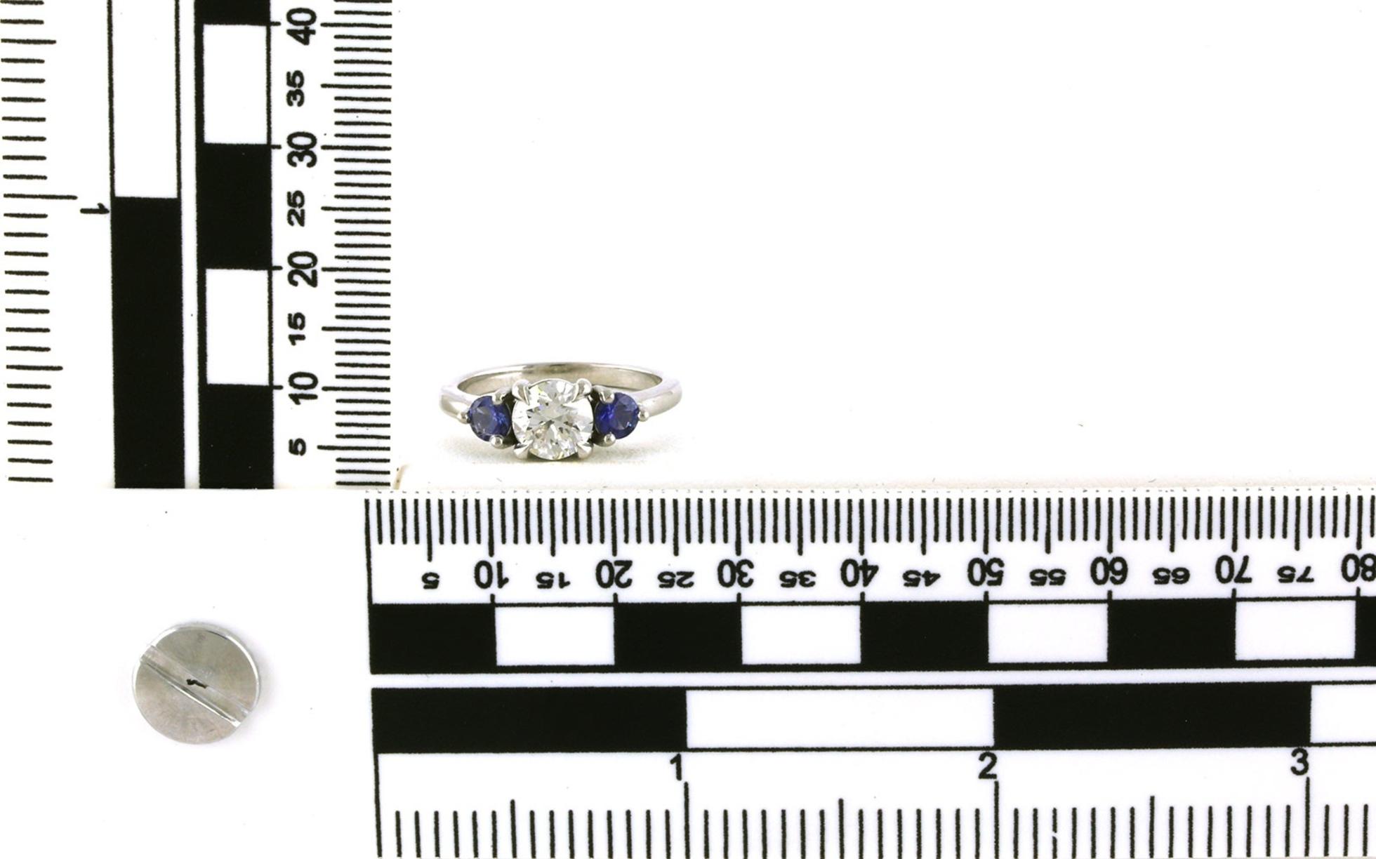 3-Stone Prong-Set Diamond and Montana Yogo Sapphire ring in Platinum (1.51cts TWT) scale