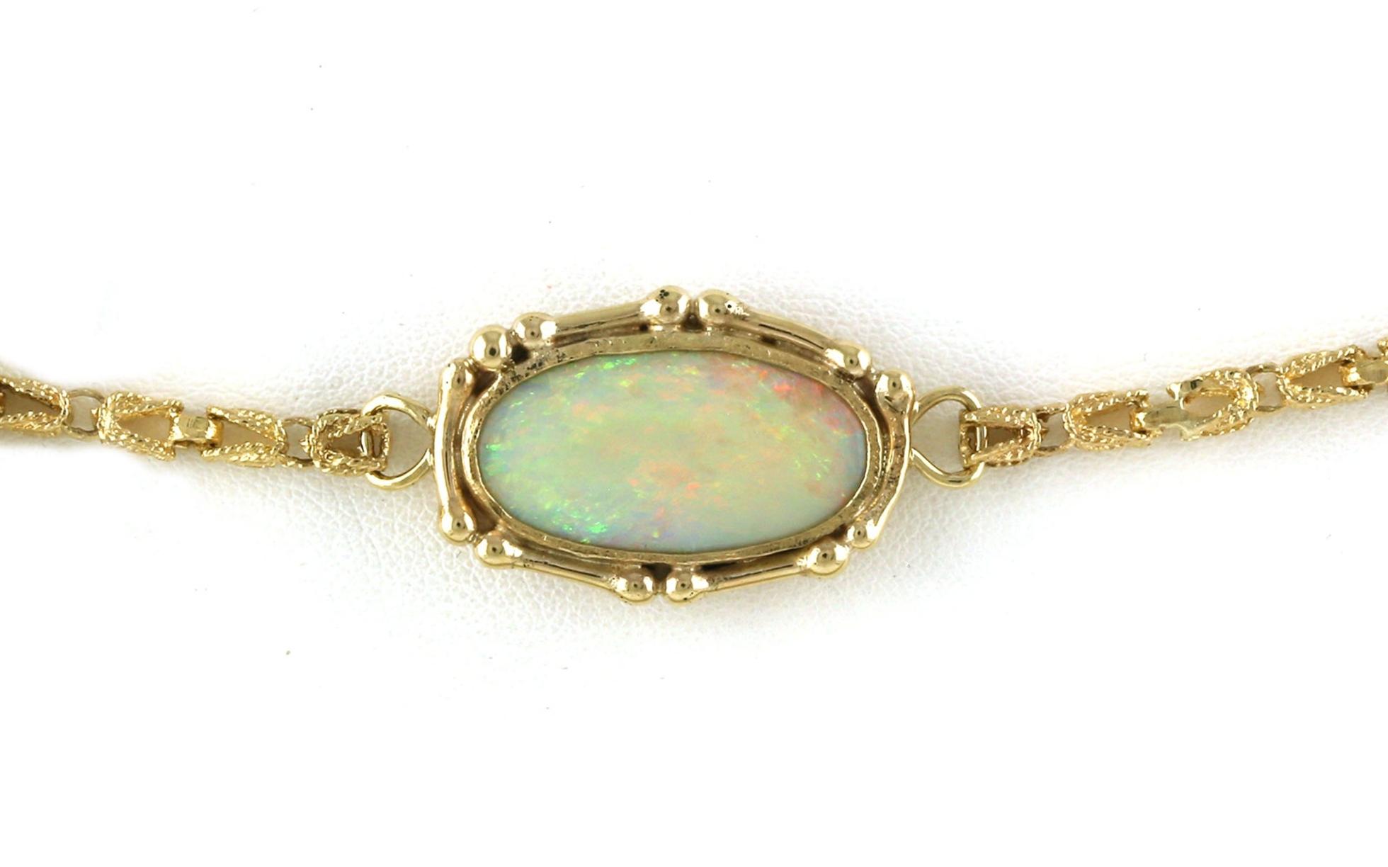 Estate Piece: Opal Decretive Bezel-set Bracelet in Yellow Gold