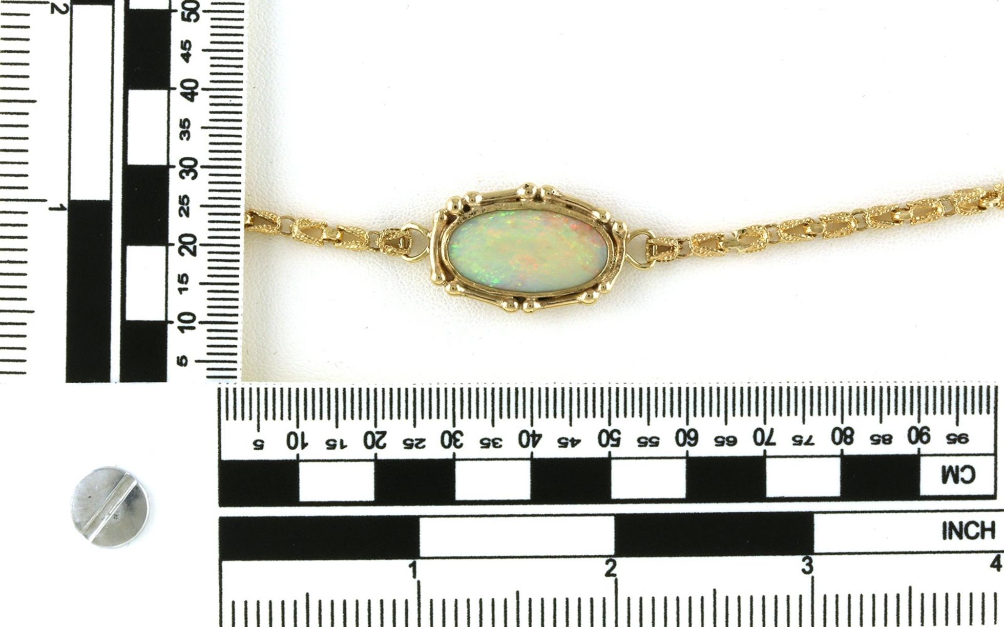 Estate Piece: Opal Decretive Bezel-set Bracelet in Yellow Gold scale
