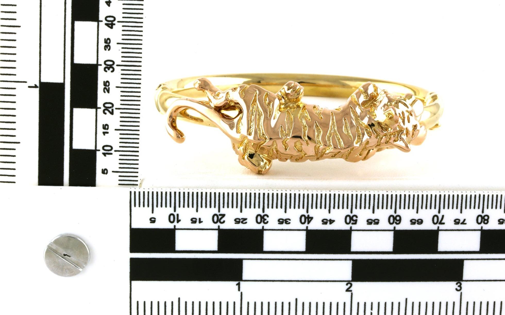 Estate Piece: Hinged Tiger Band Bracelet with Emerald Eyes in Yellow Gold (0.06cts TWT) scale