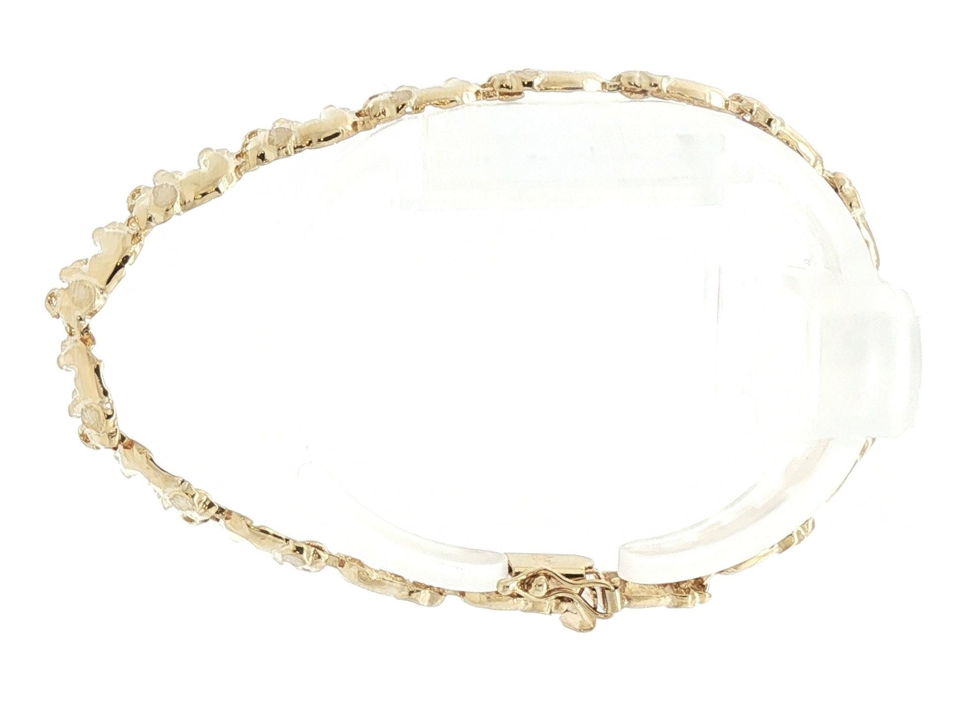 Estate Piece: Elephant Link Bracelet in Yellow Gold  side