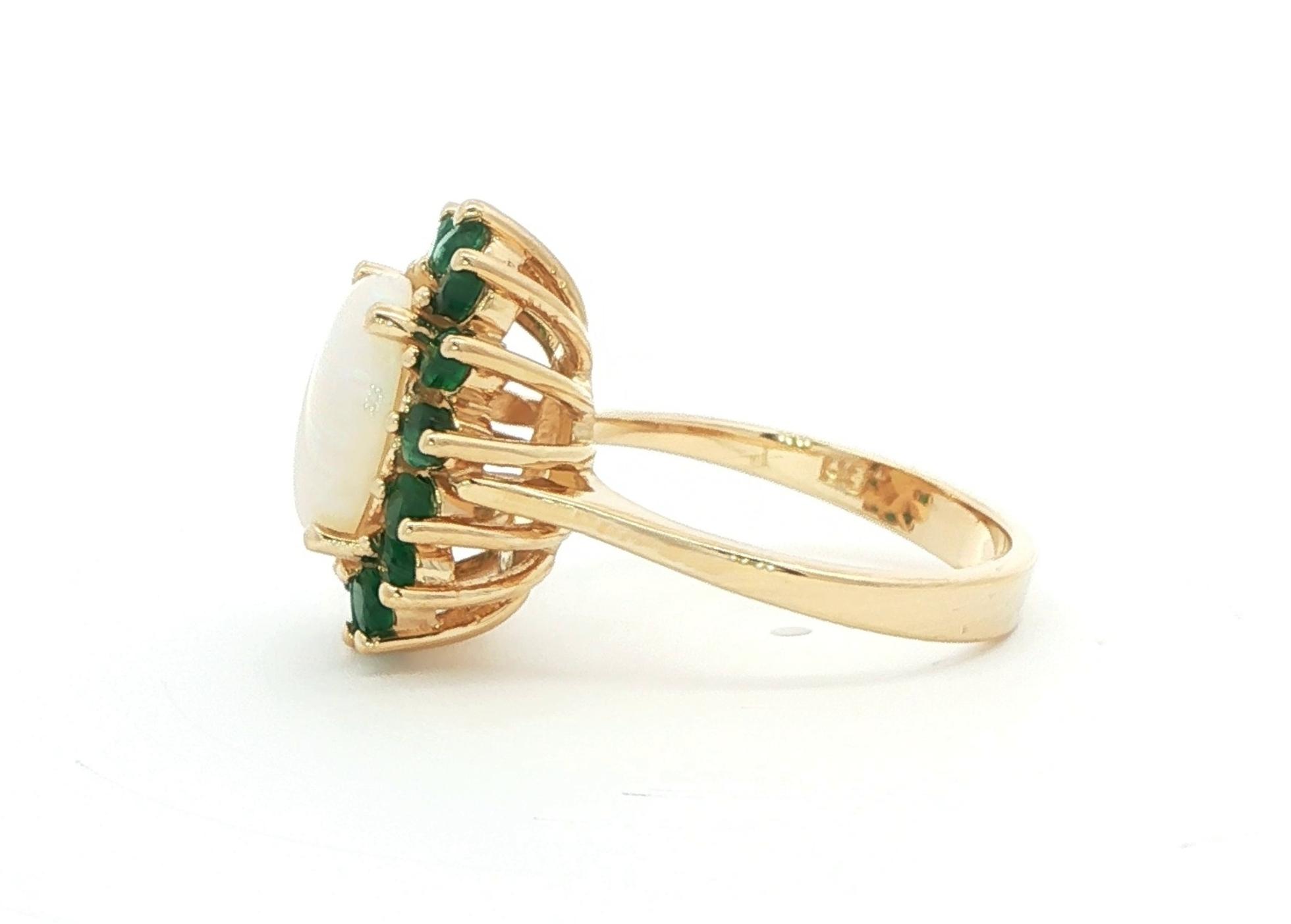 Estate Piece: Oval Opal with Emerald Halo Ring in Yellow Gold (3.75cts TWT) side