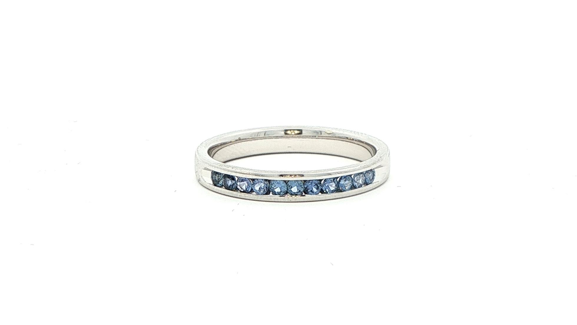 Estate Piece: 11-Stone Montana Yogo Sapphire Channel Band in White Gold (0.30cts TWT)