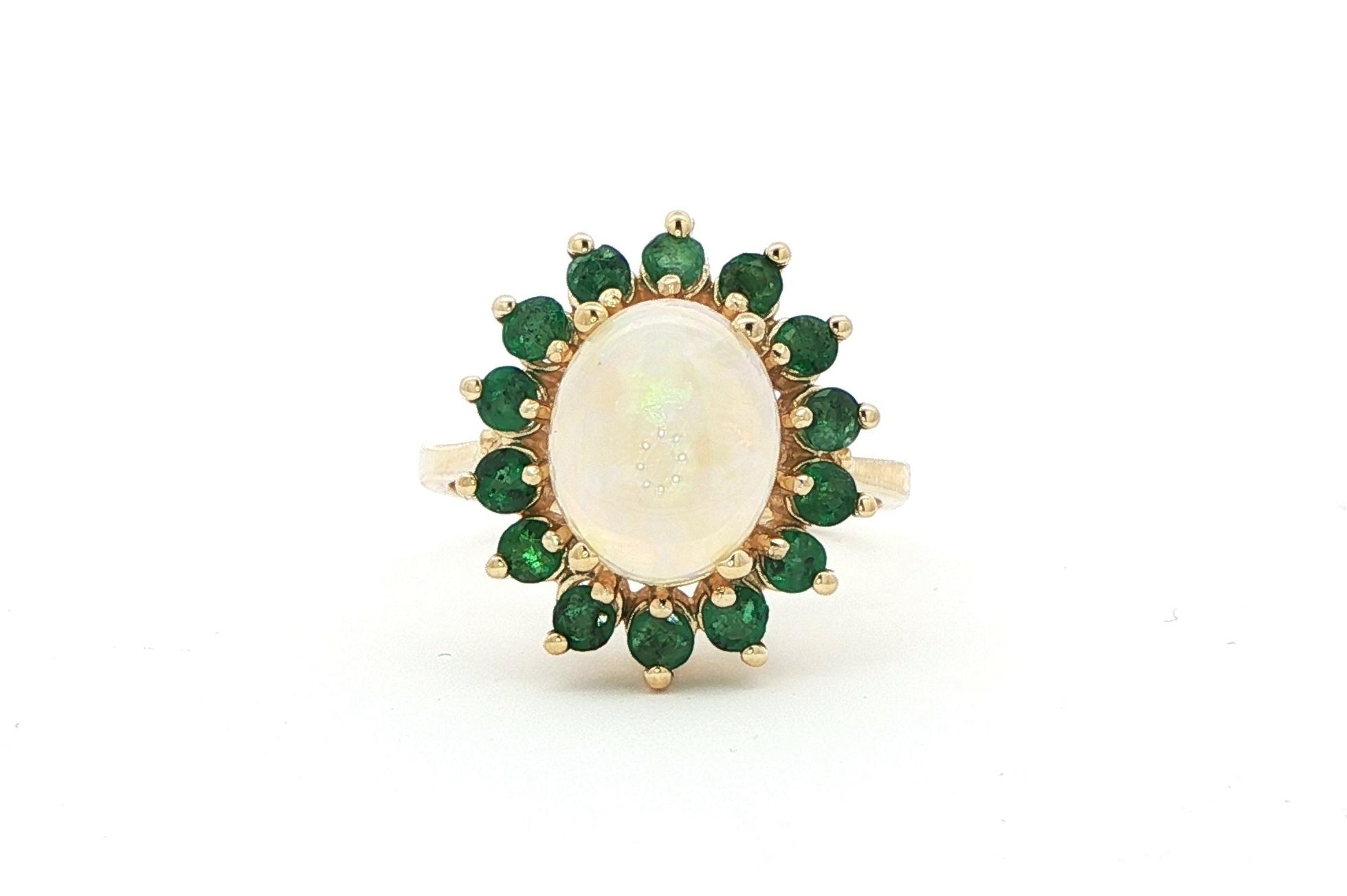Estate Piece: Oval Opal with Emerald Halo Ring in Yellow Gold (3.75cts TWT)