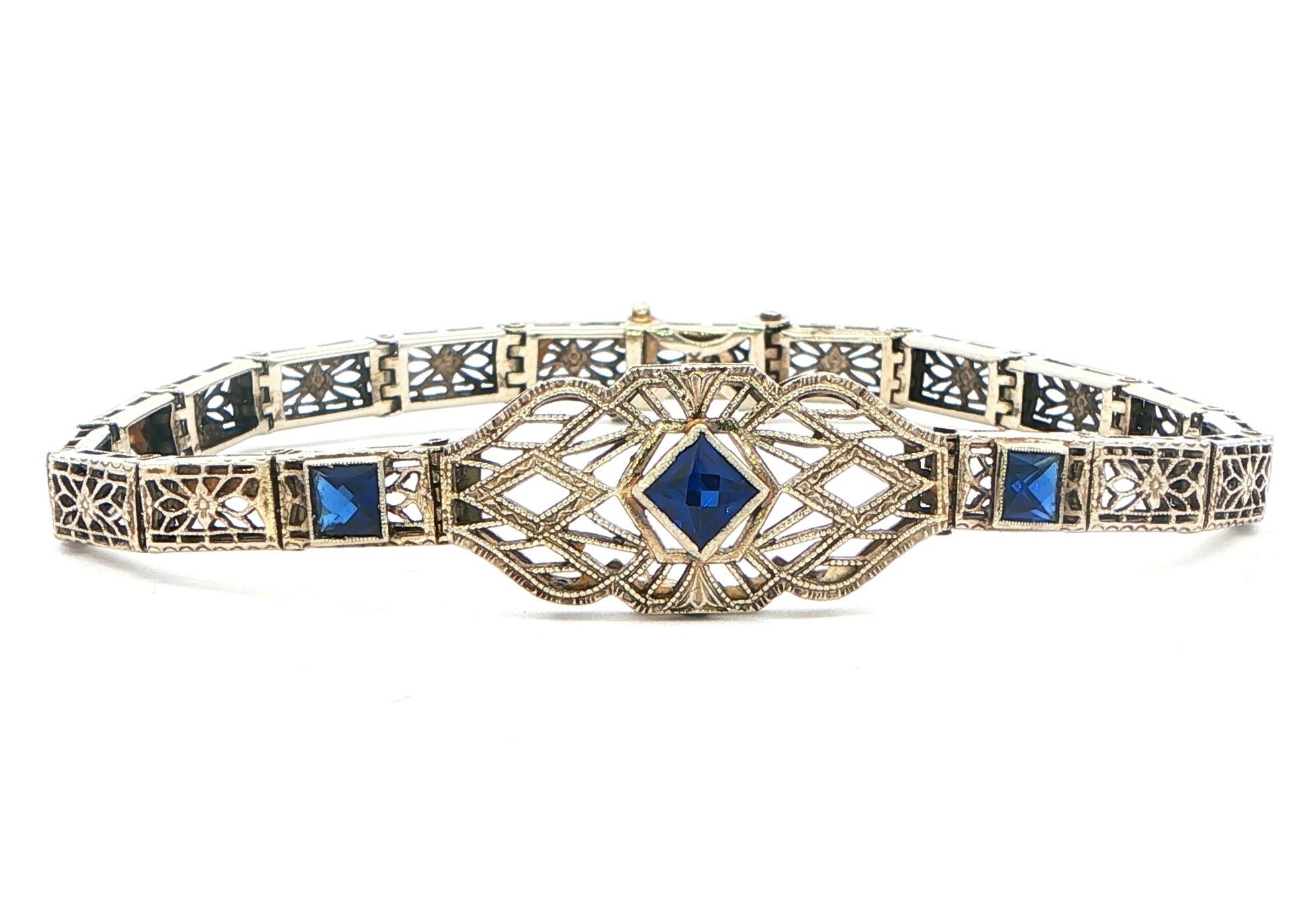 Estate Piece: Antique Filigree Synthetic Sapphire Bracelet in White Gold 