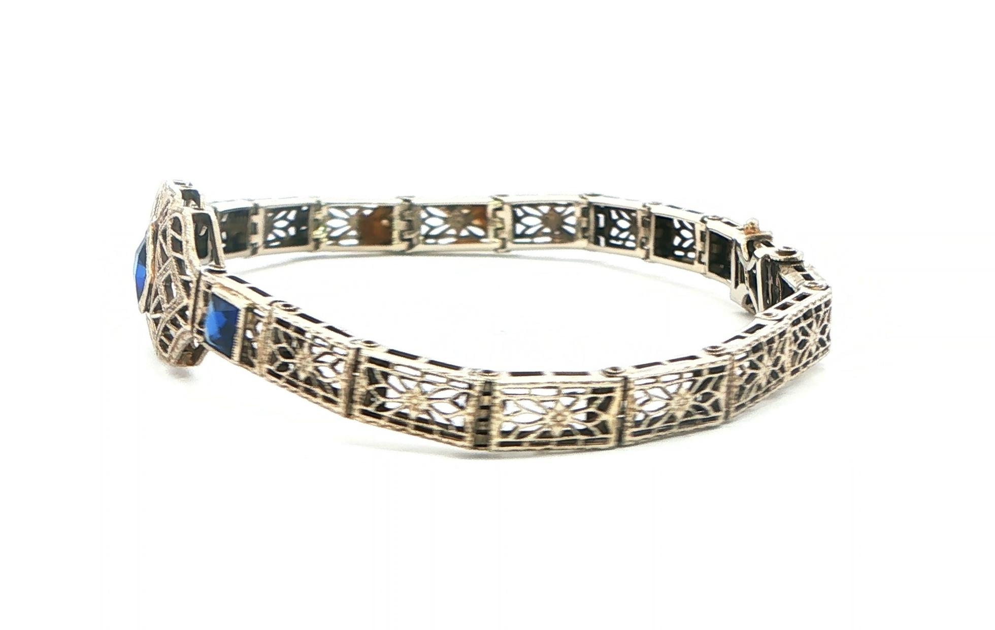 Estate Piece: Antique Filigree Synthetic Sapphire Bracelet in White Gold  side