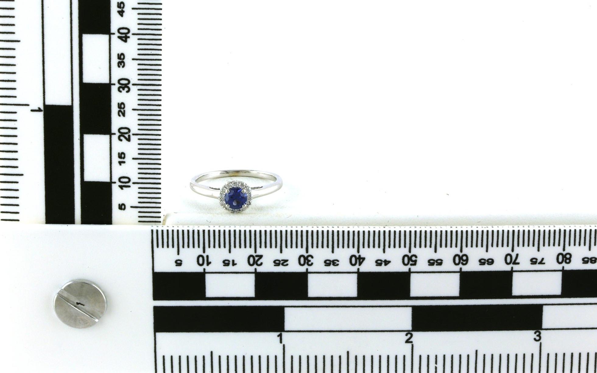 Estate Piece: Montana Yogo Sapphire and Diamond Halo Ring in White Gold (0.47cts TWT) scale