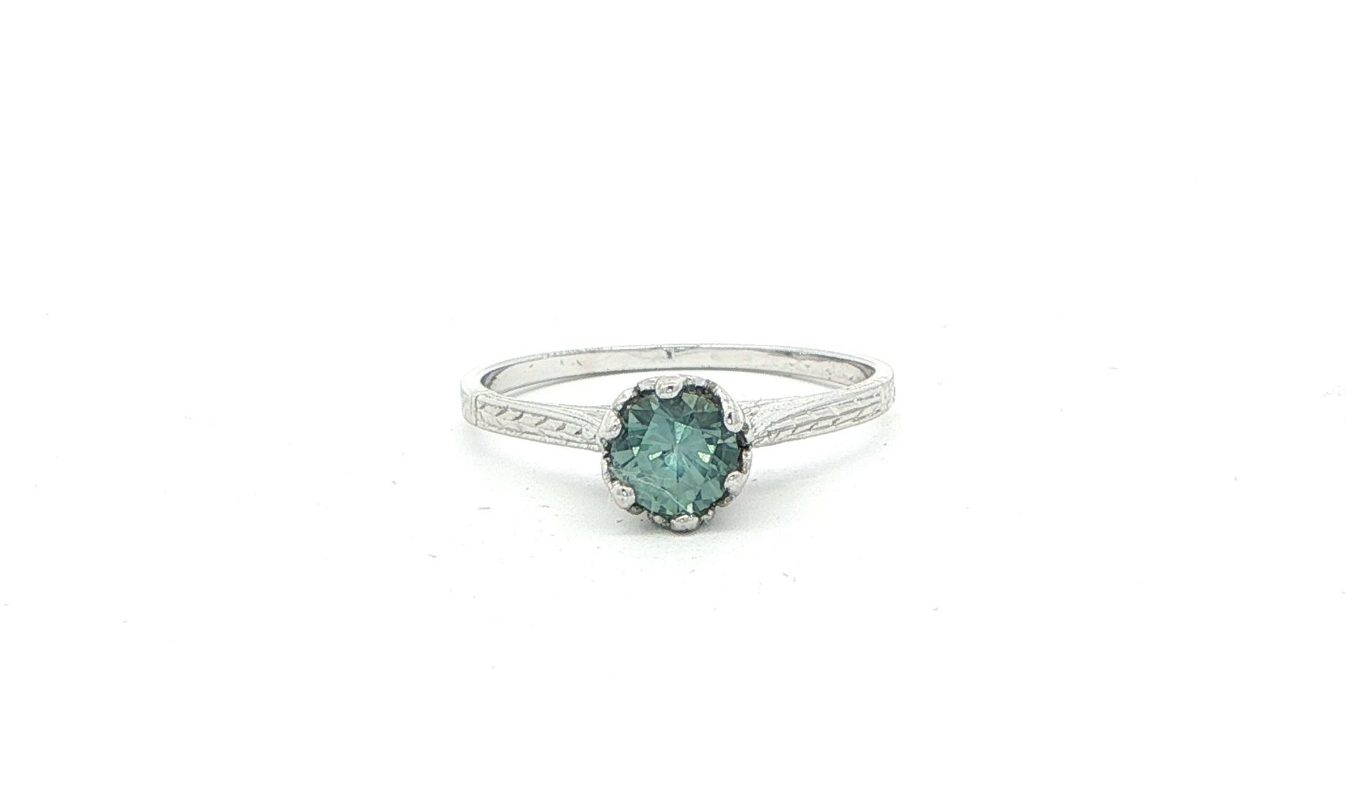 Estate Piece: Vintage Blue-Green Montana Sapphire Solitaire Ring with Engraved Details in White Gold (0.70cts)