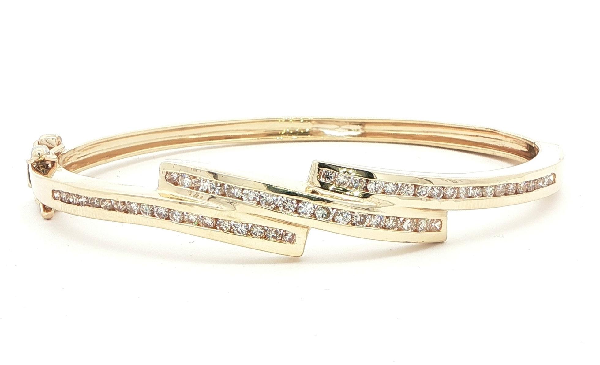 Estate Piece: Bypass-style Channel-set Diamond Hinged Bangle Bracelet in Yellow Gold (1.00cts TWT)
