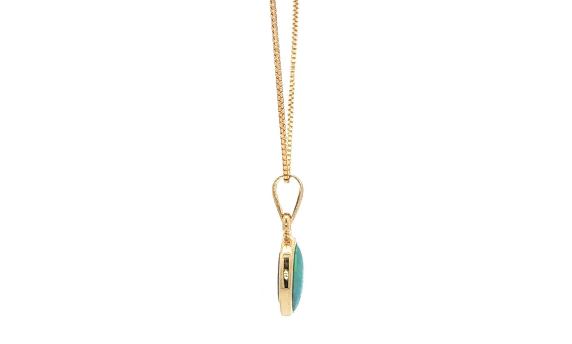 Estate Piece: Oval Bluish-Green Opal Doublet Charm Necklace in Yellow Gold side