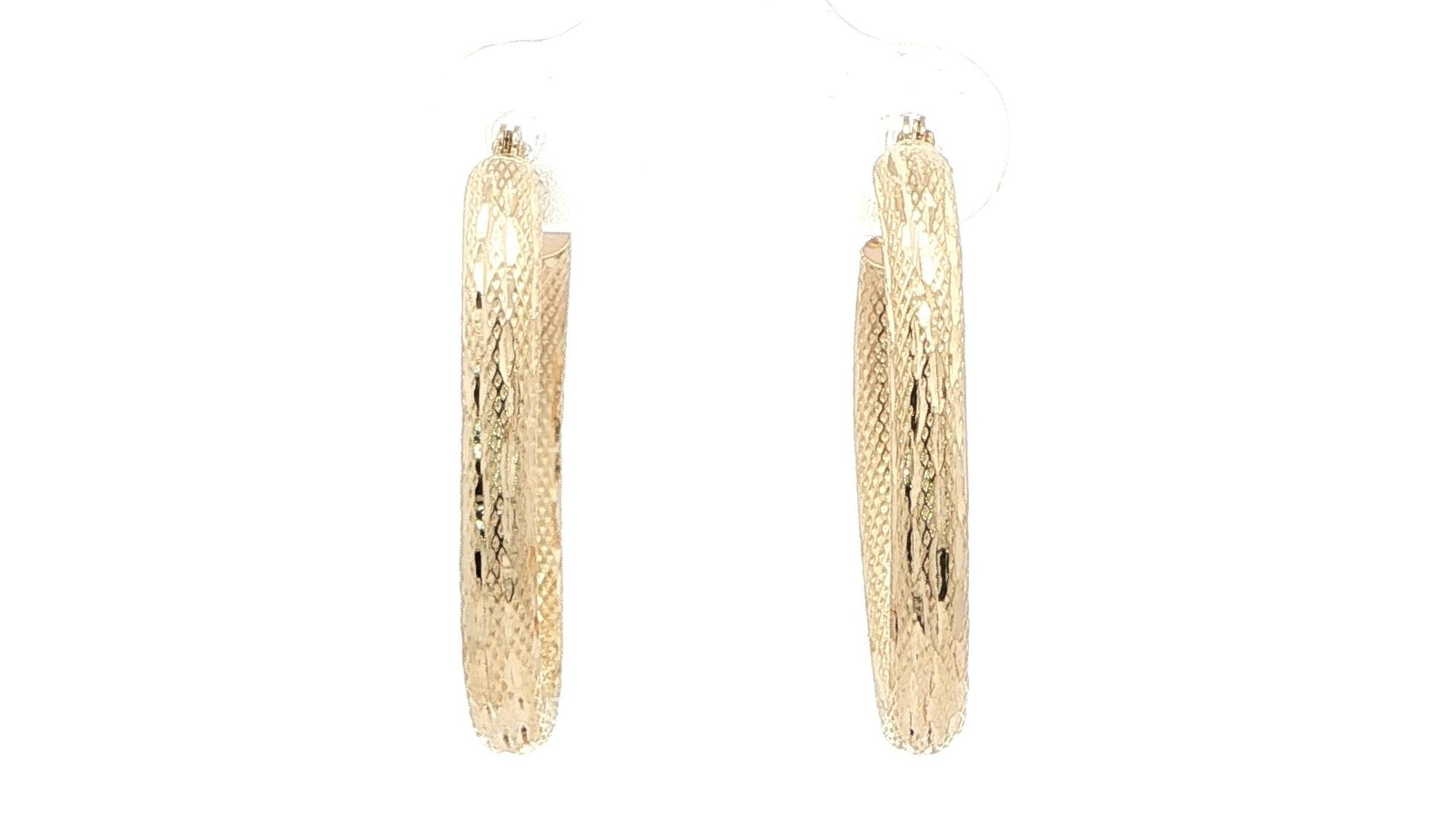 Estate Piece: Hollow Oval Hoop Earrings with Textured Finish in Yellow Gold