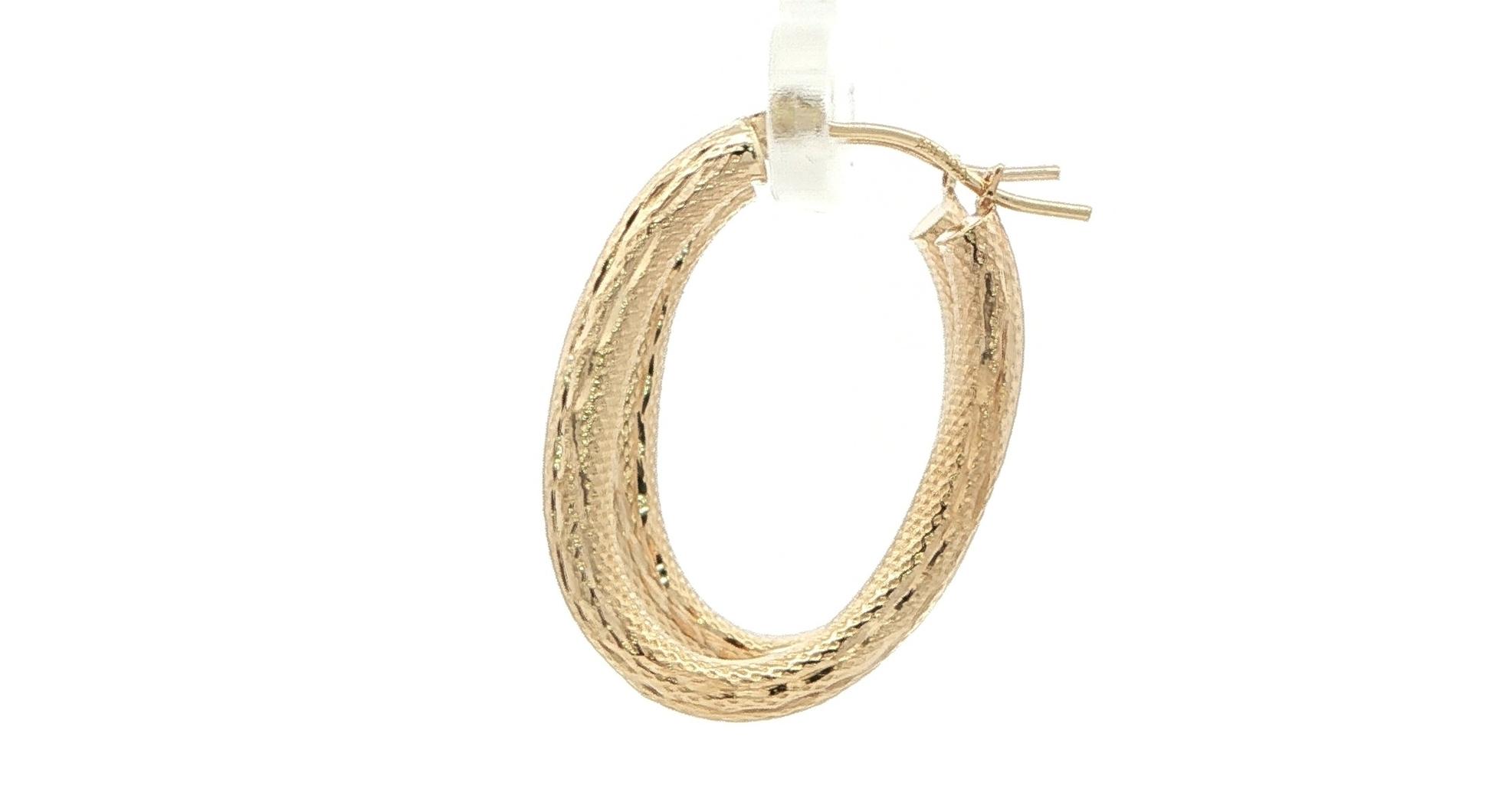 Estate Piece: Hollow Oval Hoop Earrings with Textured Finish in Yellow Gold side