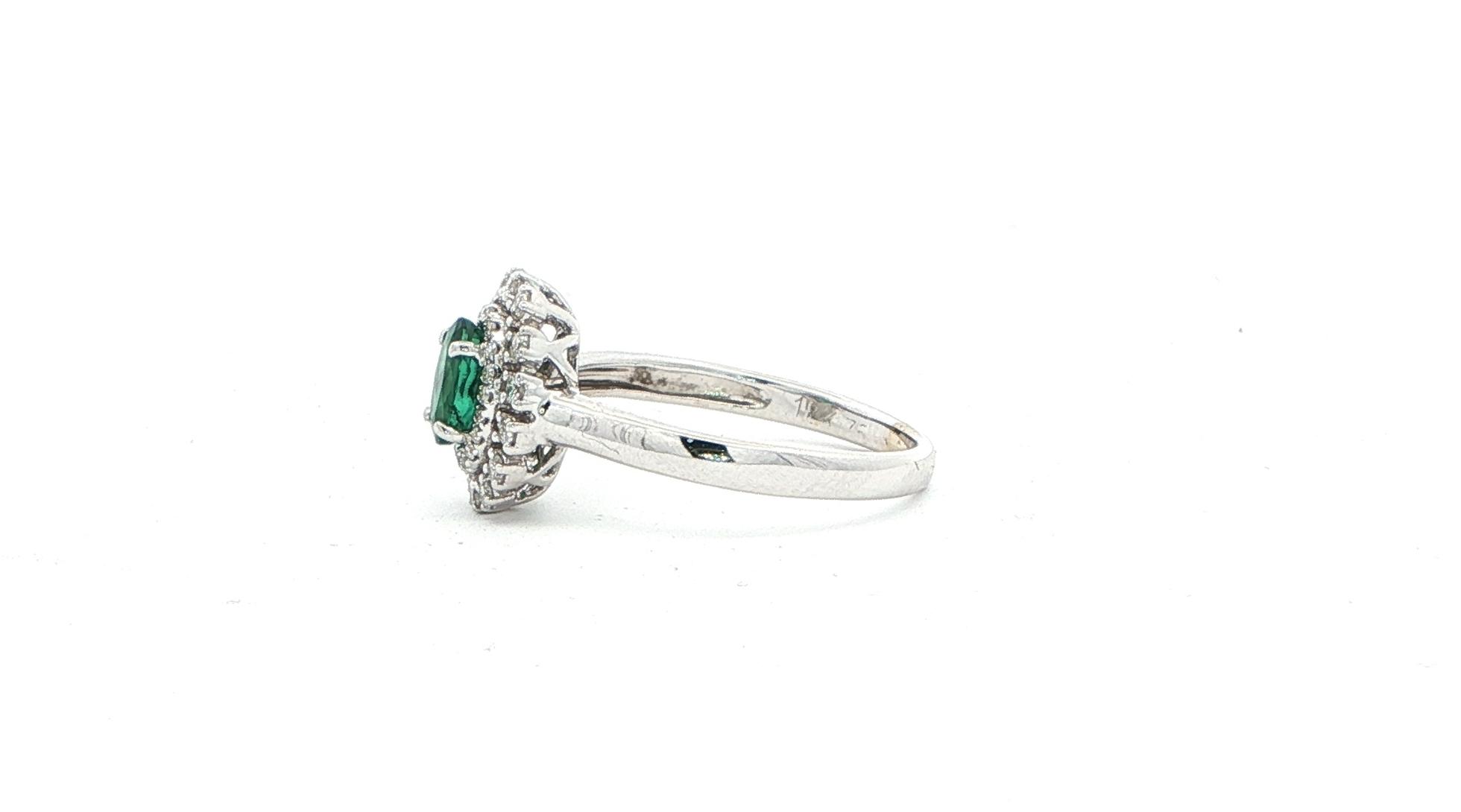 Estate Piece: Double Halo Oval Emerald and Diamond Cocktail Ring in White Gold (0.75cts TWT) side