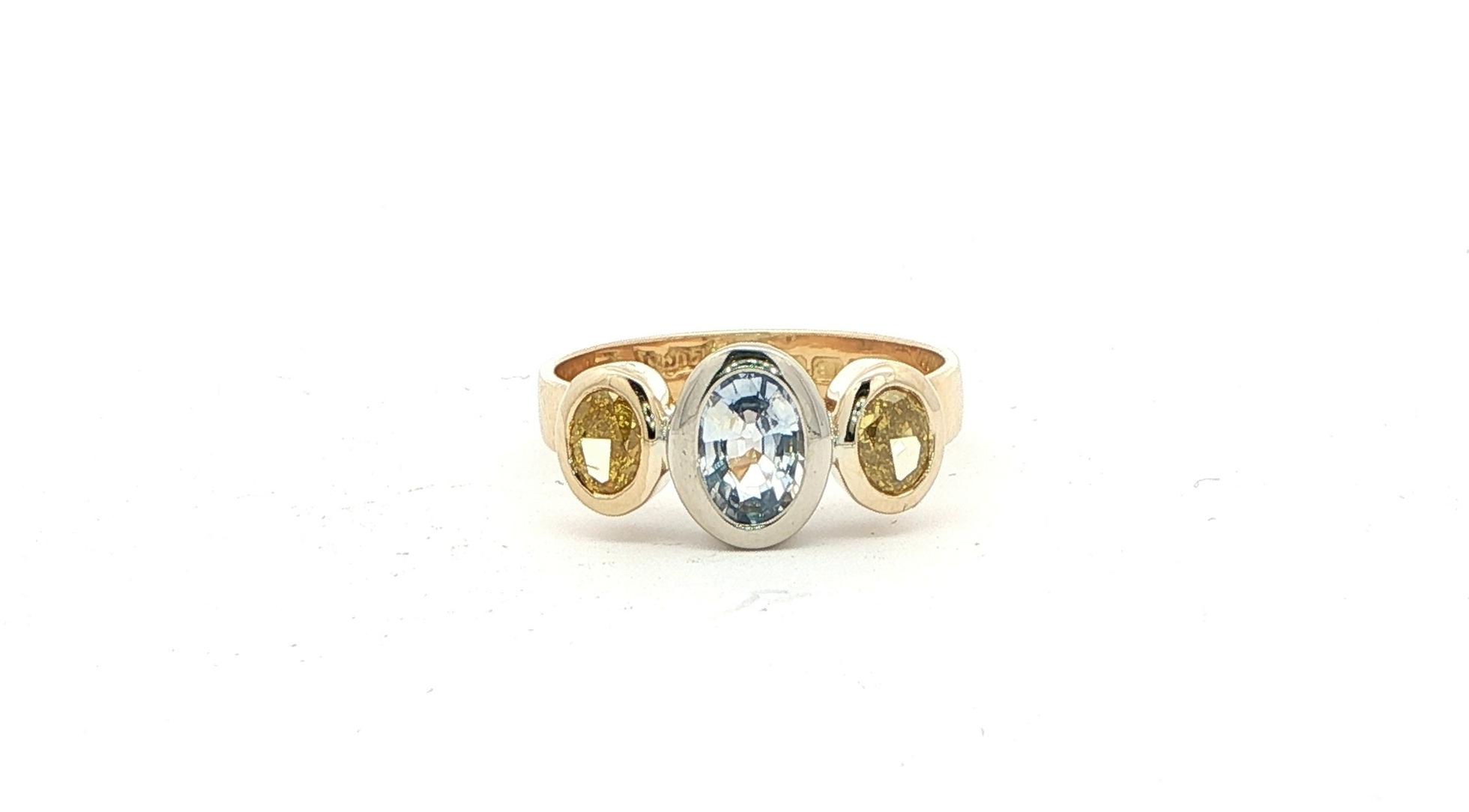 Estate Piece: 3-Stone Oval Pale Blue Sapphire and Yellow Diamond Ring in Two-tone Yellow and White Gold (1.50cts TWT)