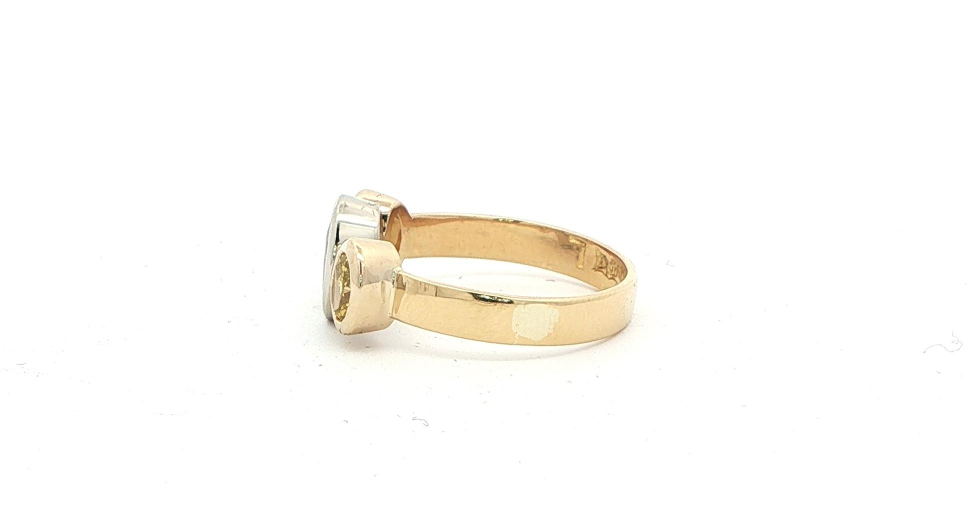 Estate Piece: 3-Stone Oval Pale Blue Sapphire and Yellow Diamond Ring in Two-tone Yellow and White Gold (1.50cts TWT) side