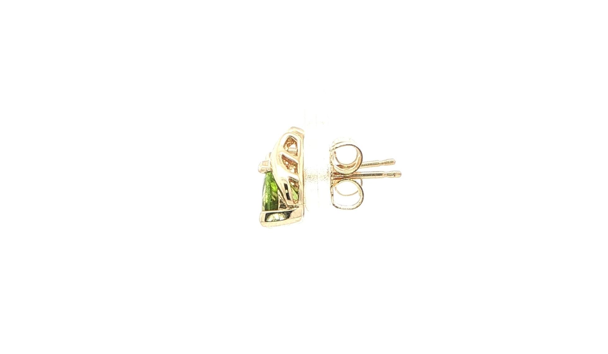 Estate Piece: Trillion Peridot and Diamond Stud Earrings in Yellow Gold  side